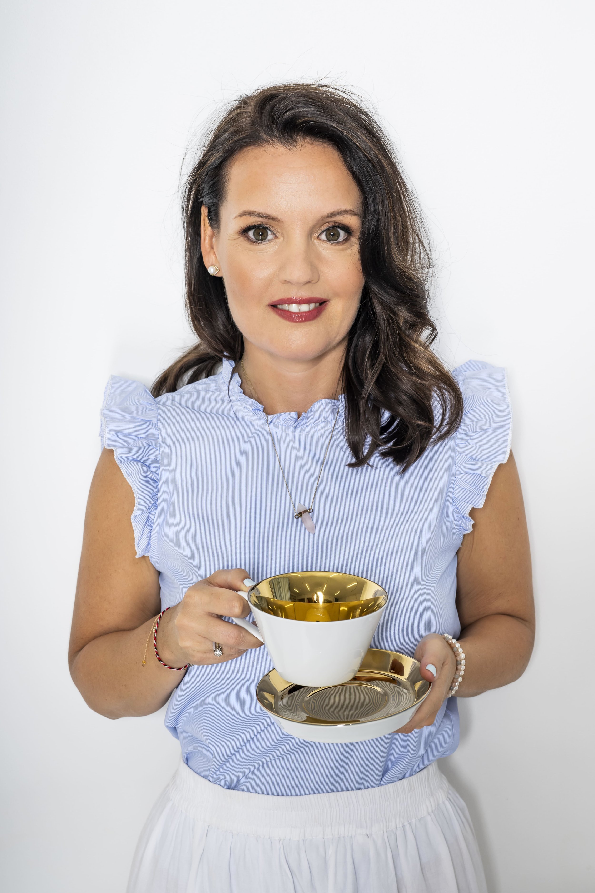 Justyna Teubler, MUUD Academy Course Director, holding a teacup