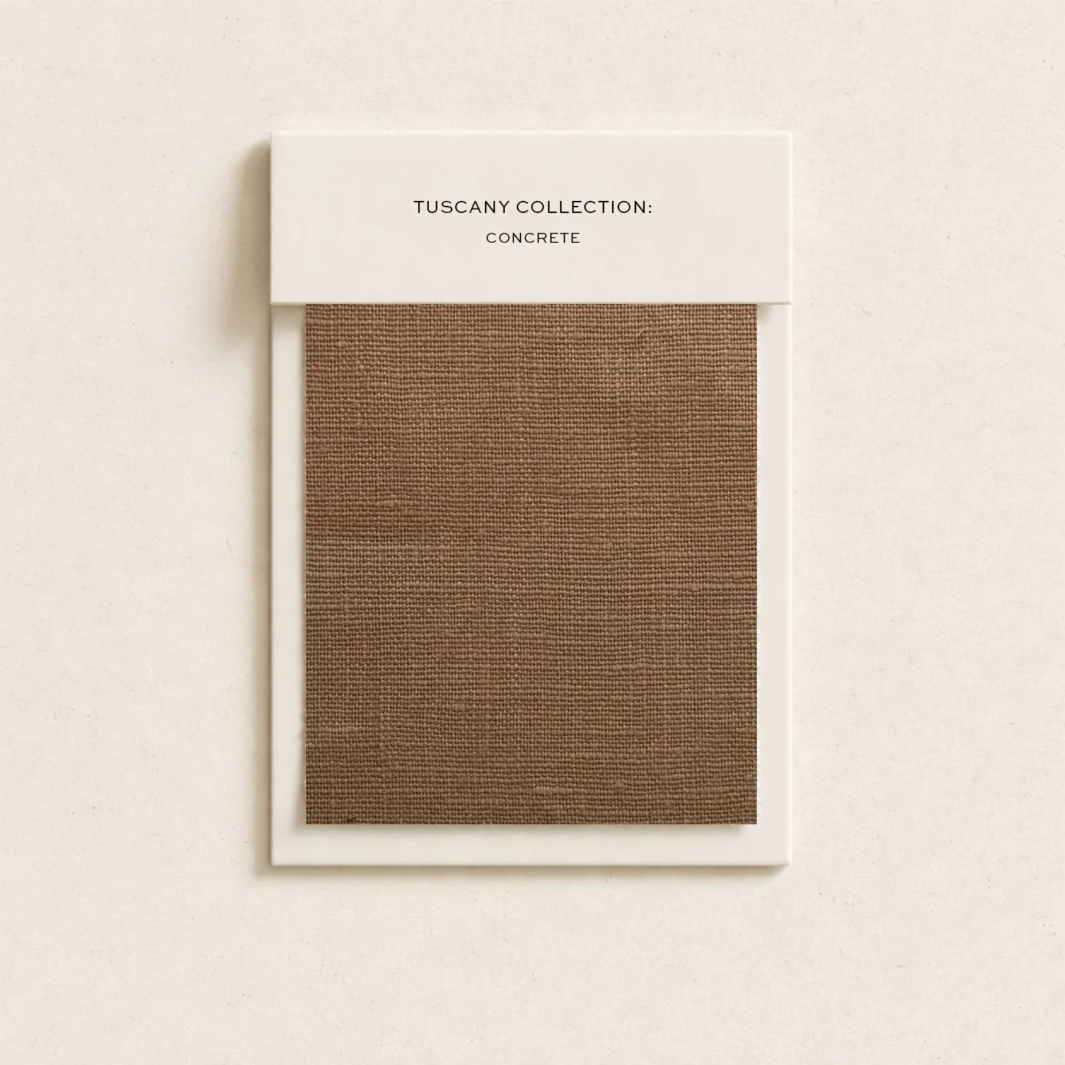 Color swatch sample of textured brown material from the Tuscany Collection, labeled 'Concrete'.