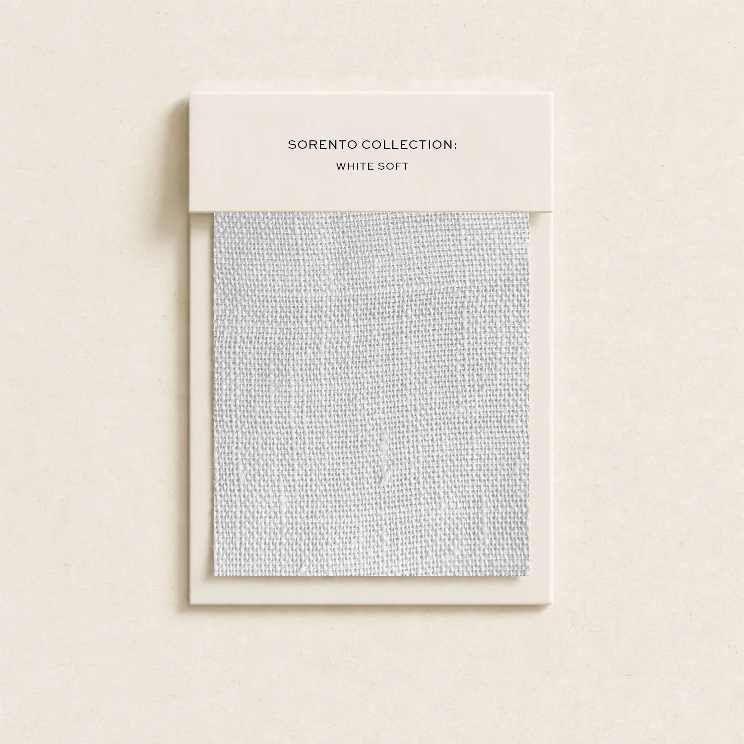 A fabric sample card with a white textured fabric swatch attached, labeled 'Sorento Collection: White Soft'.