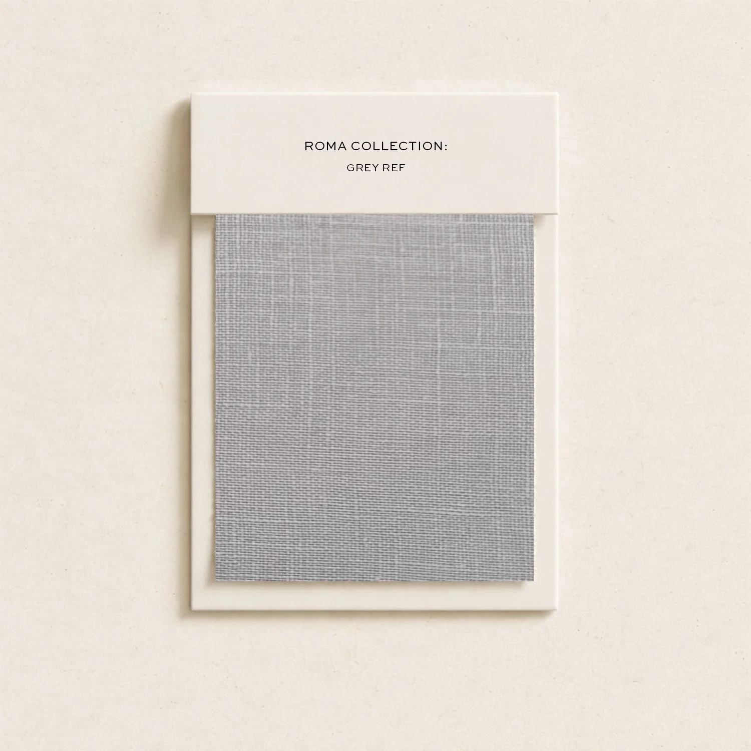 Sample of grey fabric swatch from Roma Collection, labeled Grey Ref.
