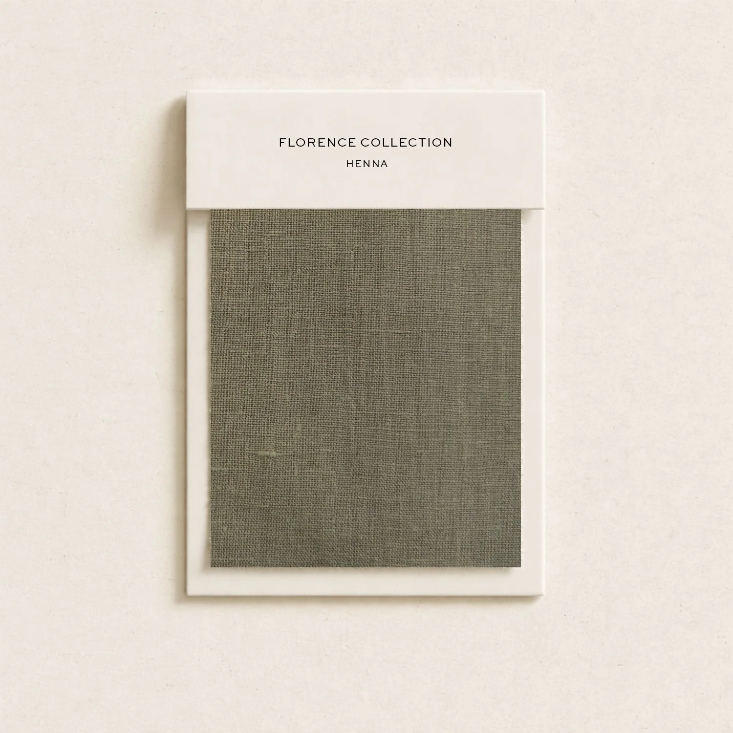 A sample book or swatch card titled 'Florence Collection Henna' showing a fabric sample.