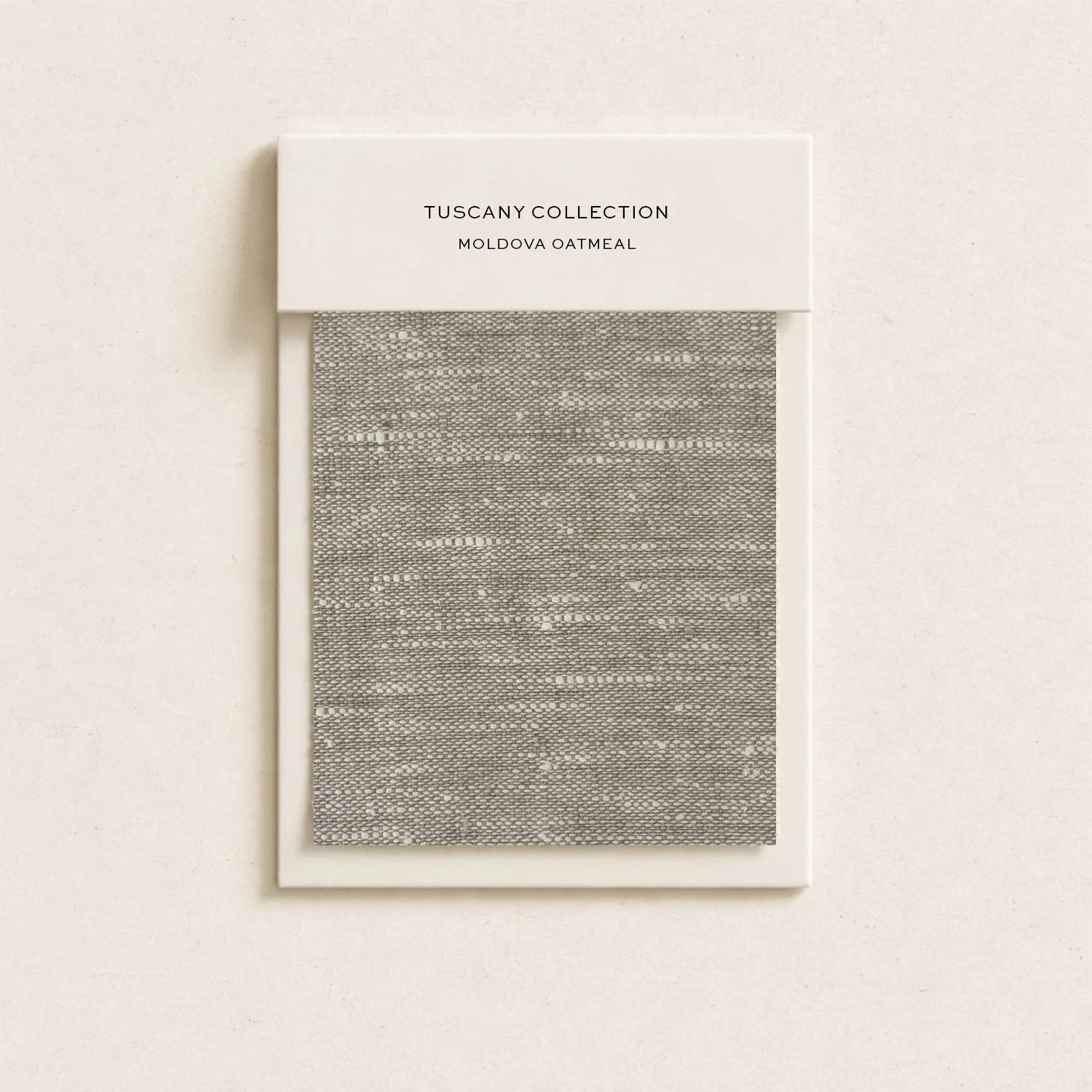 A sample of Moldova oatmeal from the Tuscany Collection, showcased in a rectangular frame with a white top label, printed with black text.
