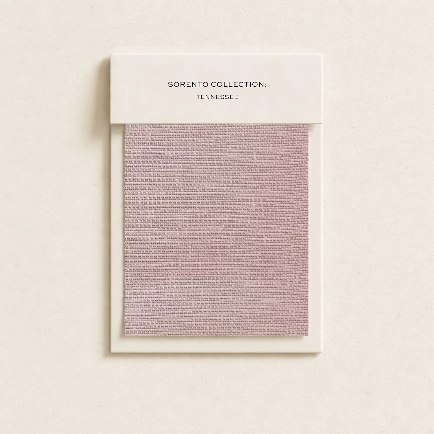 Sample fabric swatch from the Sorento Collection: Tennessee, in pink color, mounted on a white card with the collection name.