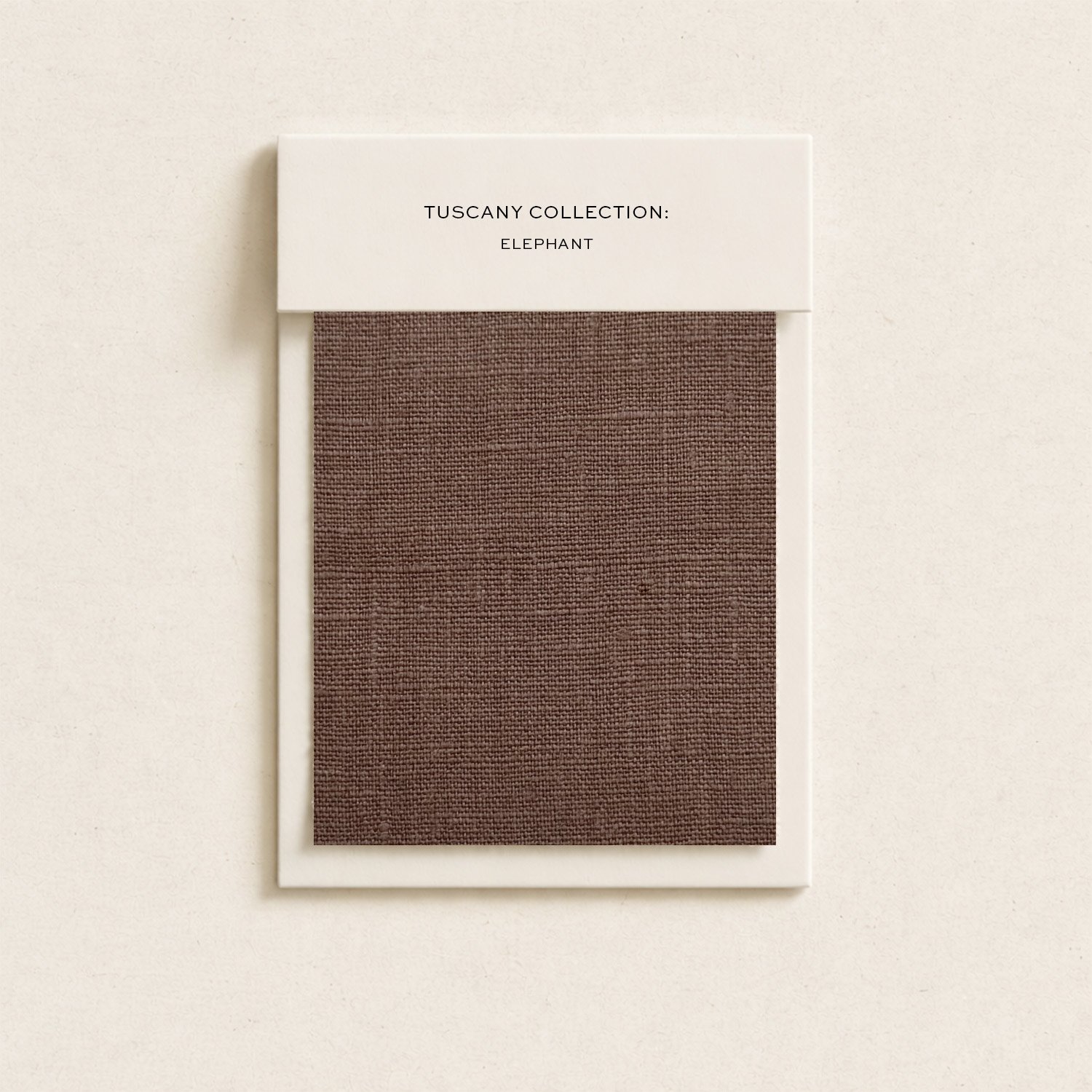 Sample fabric swatch from the Tuscany Collection, featuring an elephant pattern in brown.