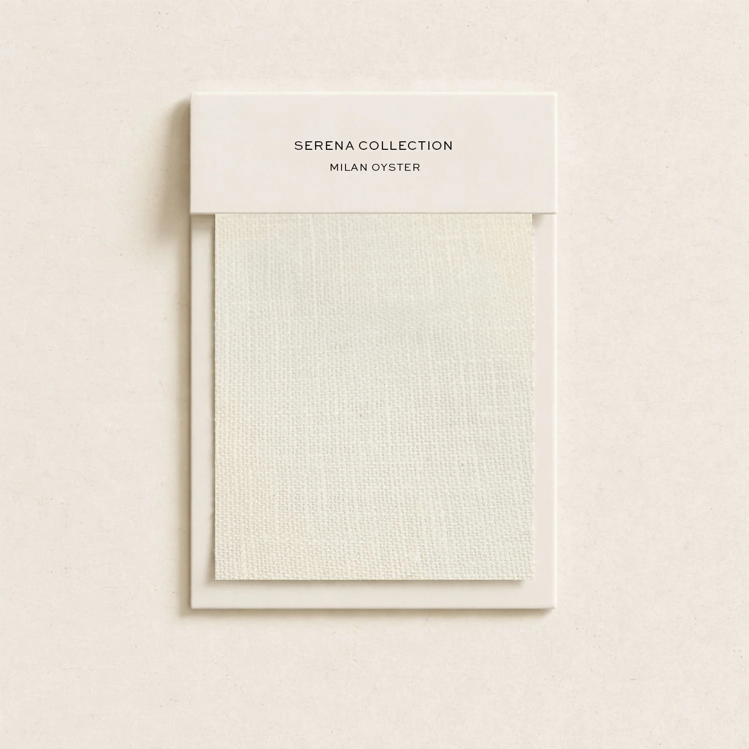 A white background shows a color swatch sample card labeled 'Serena Collection, Milan Oyster' with a textured fabric sample attached.