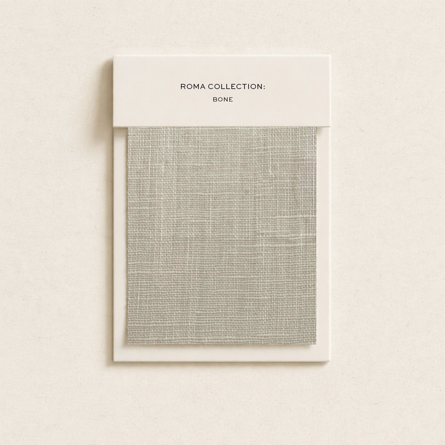 A fabric sample from the Roma Collection labeled 'Bone', mounted on a white background.