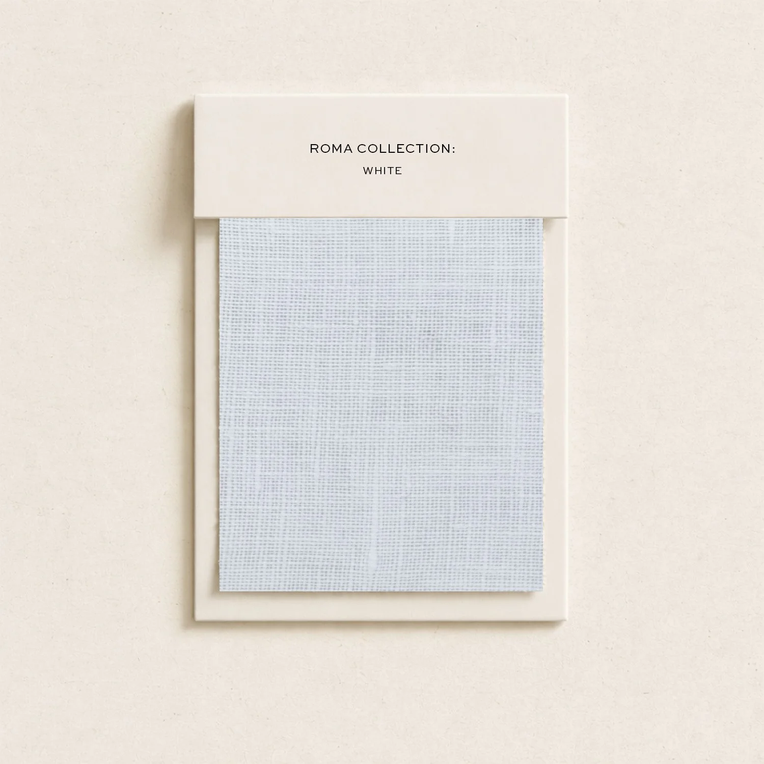 White framed mesh screen with a top label reading 'Roma Collection: White' on a white wall.