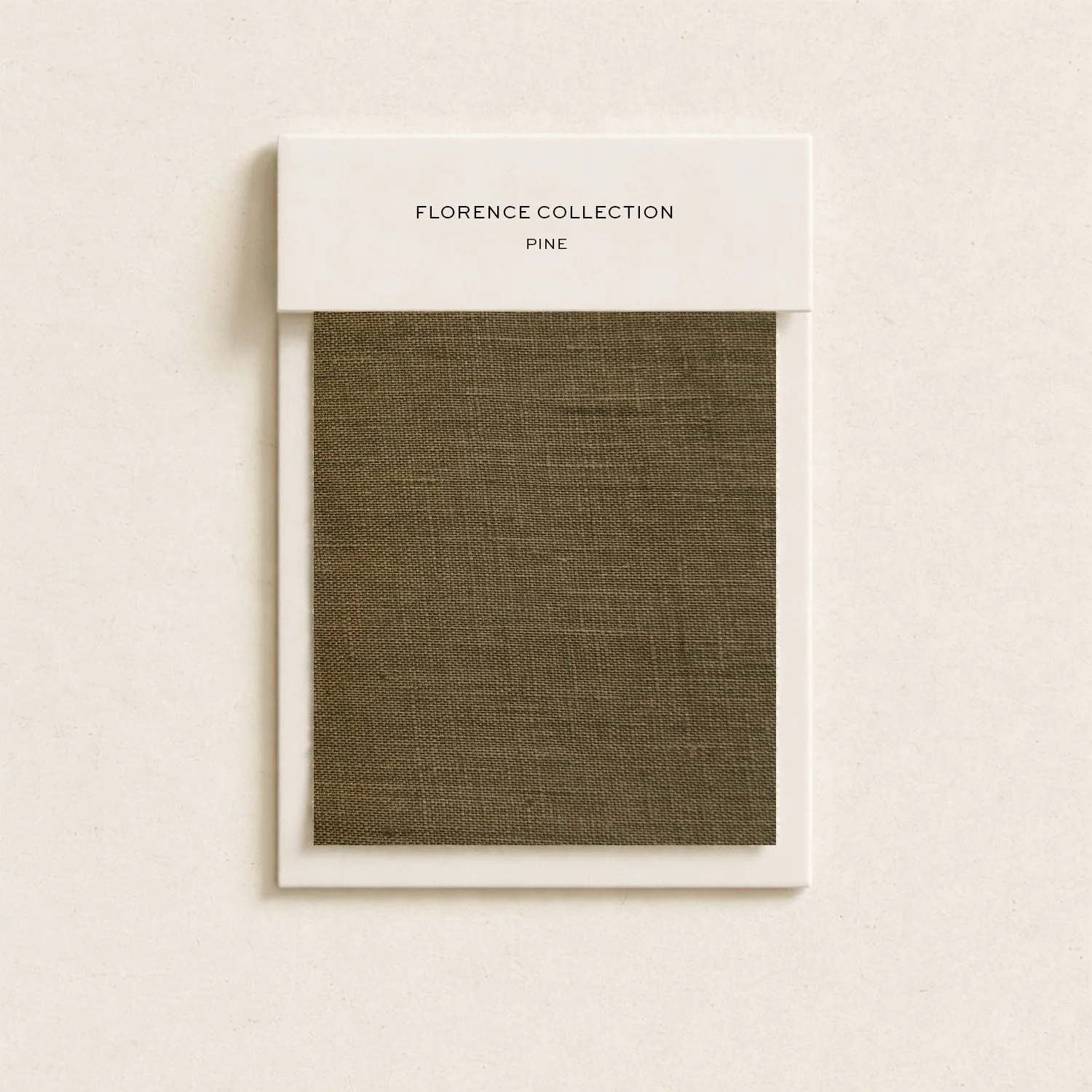 Swatch of brown pine wood sample on a white frame with a white label reading 'Florence Collection Pine' mounted on a plain white background.