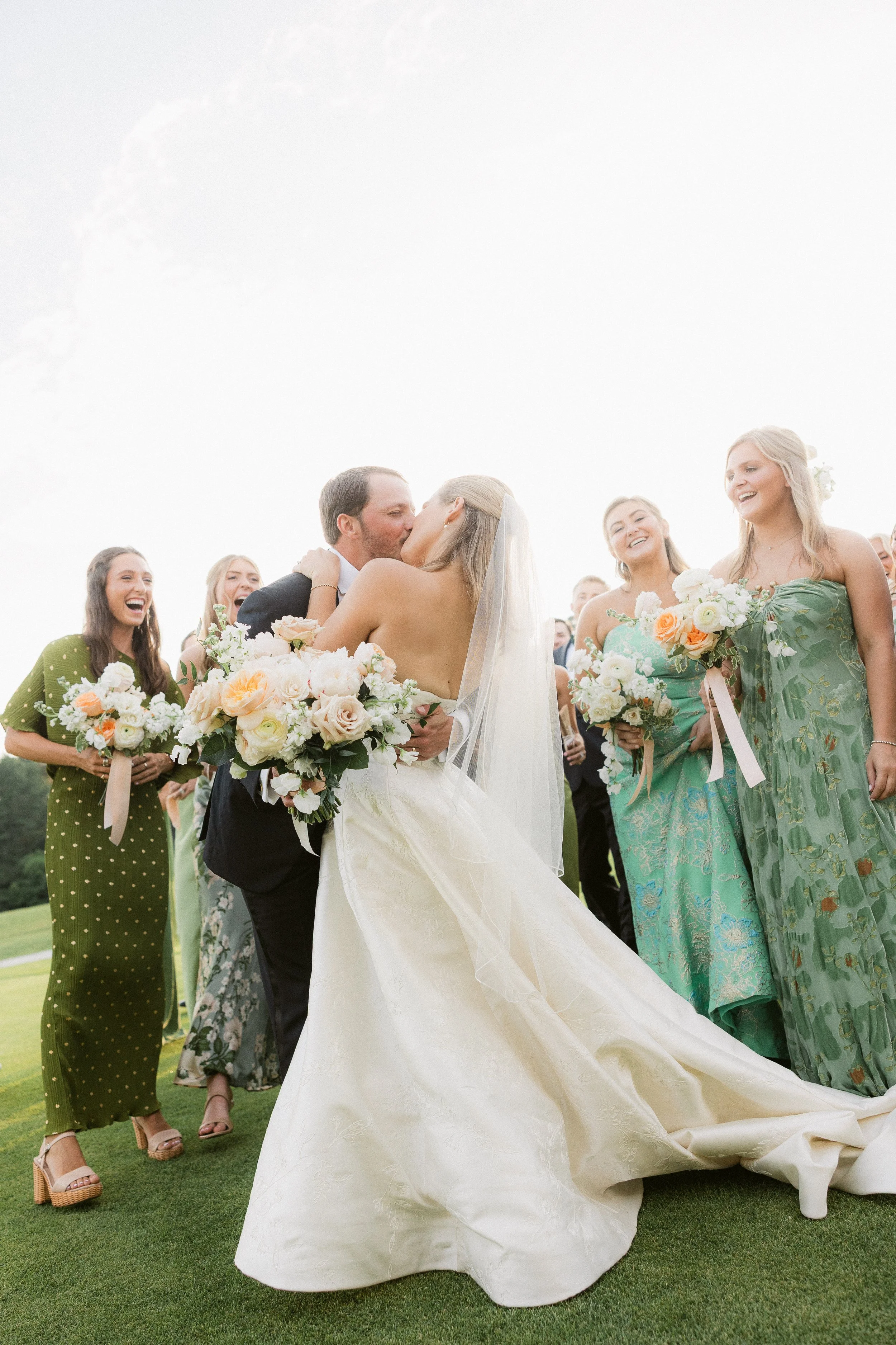 Bride and groom celebrating with their wedding party