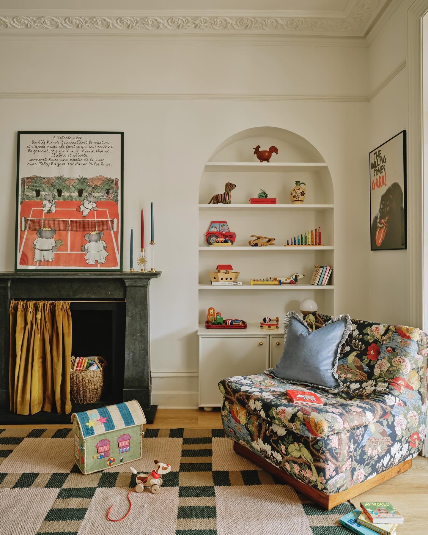 The playroom in my recently completed West London project 🧸🎈.. we added these arched alcoves either side of the fireplace with shelving &amp; storage below (the bun feet 🥹). This armchair - one of a pair, I sourced at Kempton market and reupholste