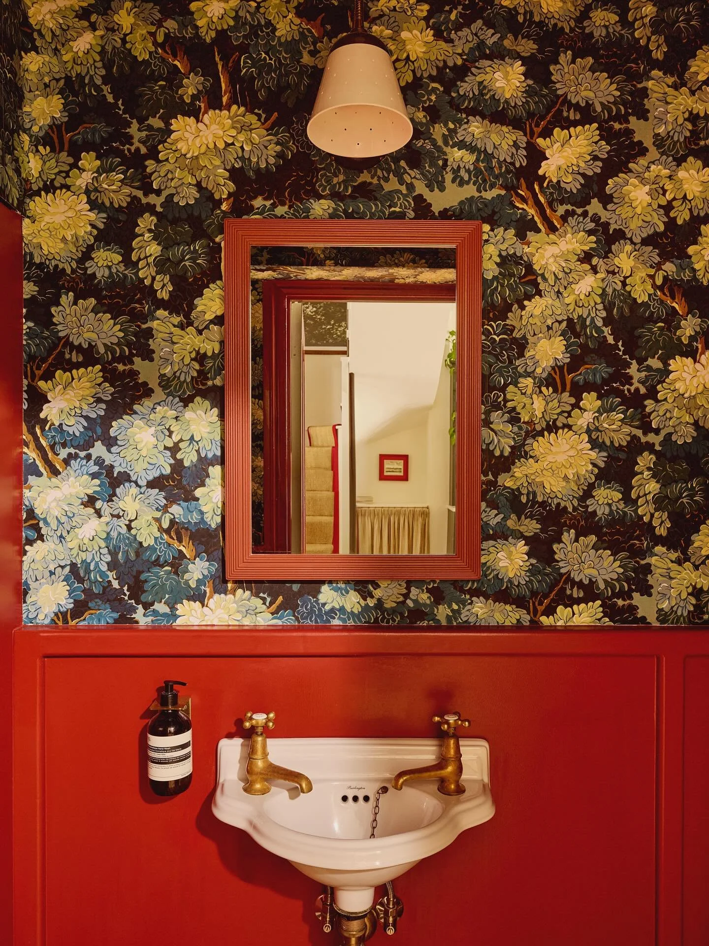 A moment for our take on the iconic &lsquo;unexpected red theory&rsquo; in the home of Michelle Dockery, highlighted here in the tiny downstairs loo. You&rsquo;ll see a thread of red pops throughout the house and we really lent into it here. I love a