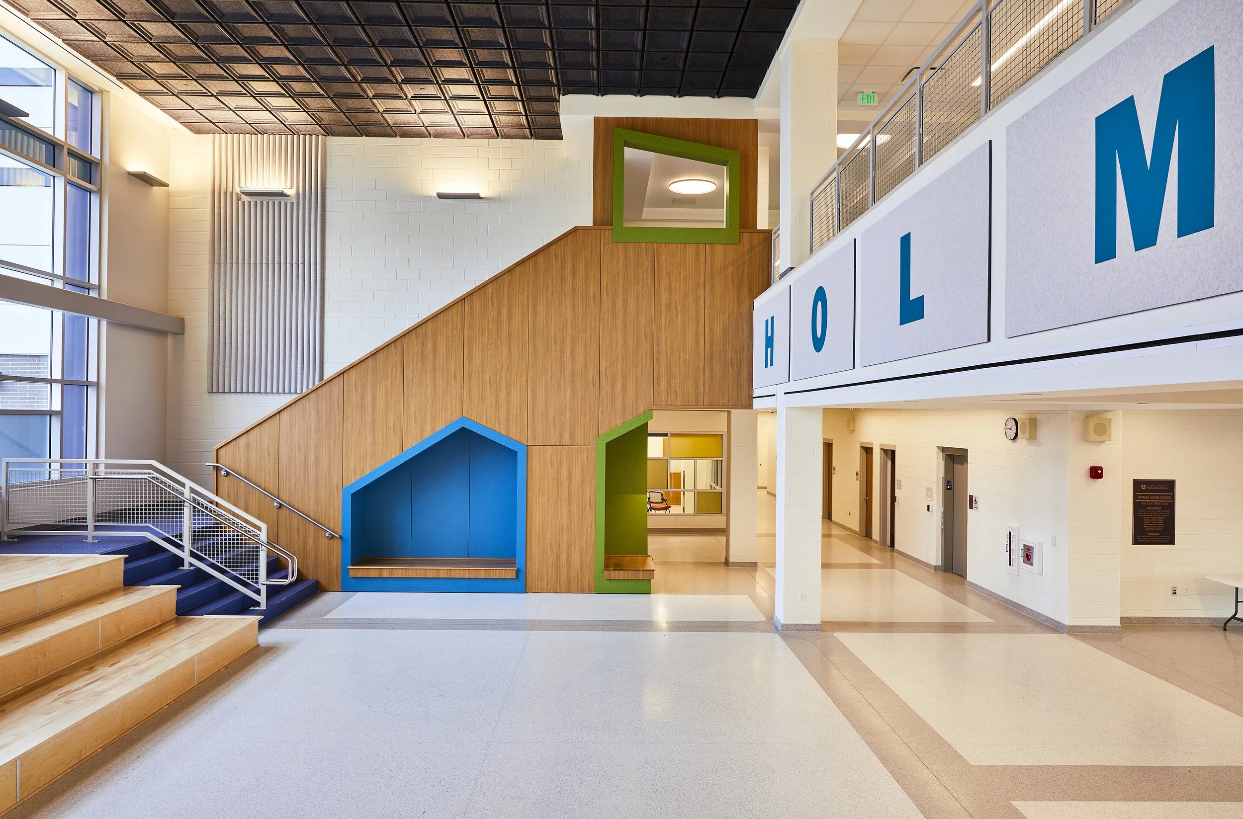 Entry atrium of Thomas Holme Elementary School in Philadelphia showcasing gorgeous Millwork Staircase