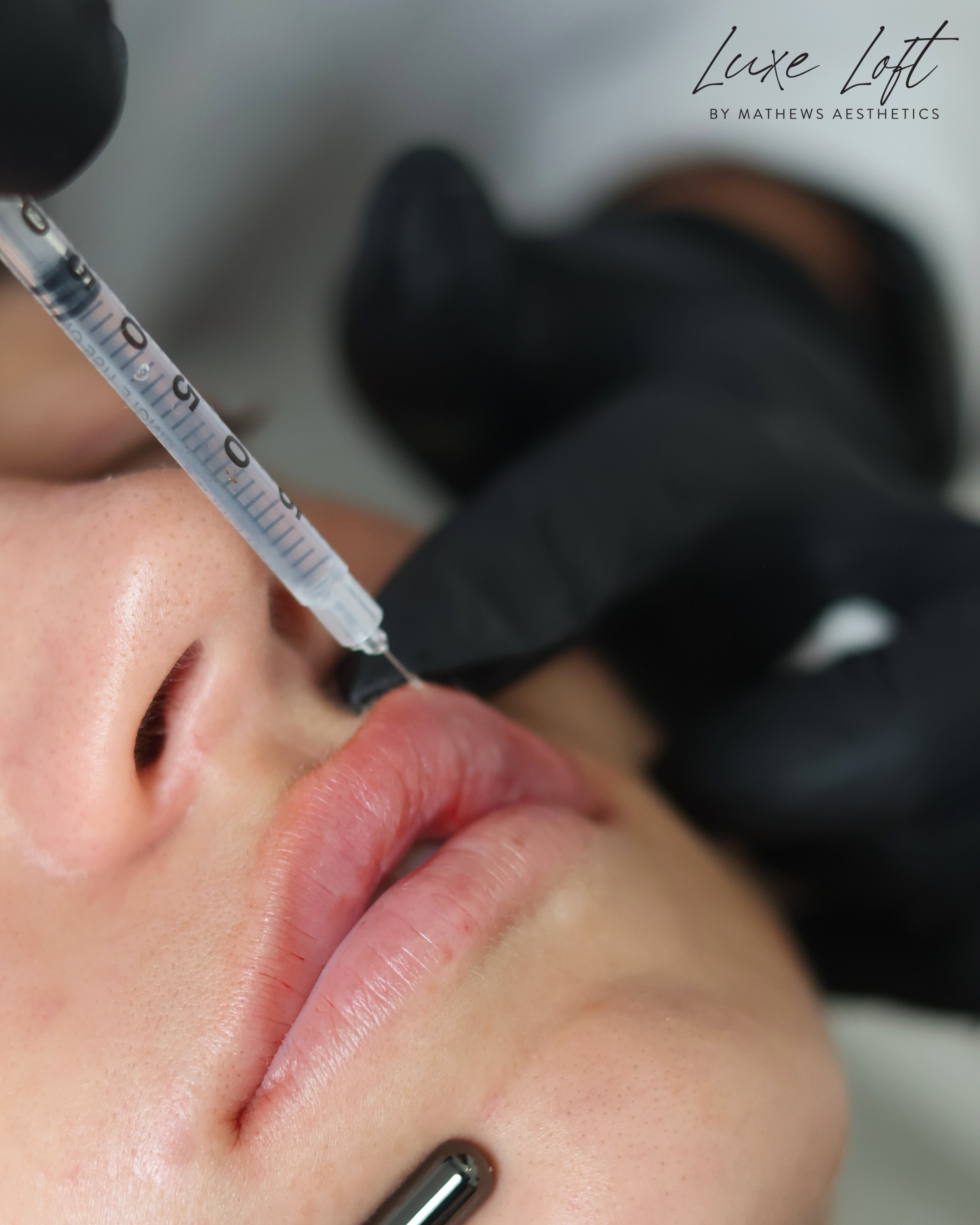 Close-up of a person's lips and nose in black and white.