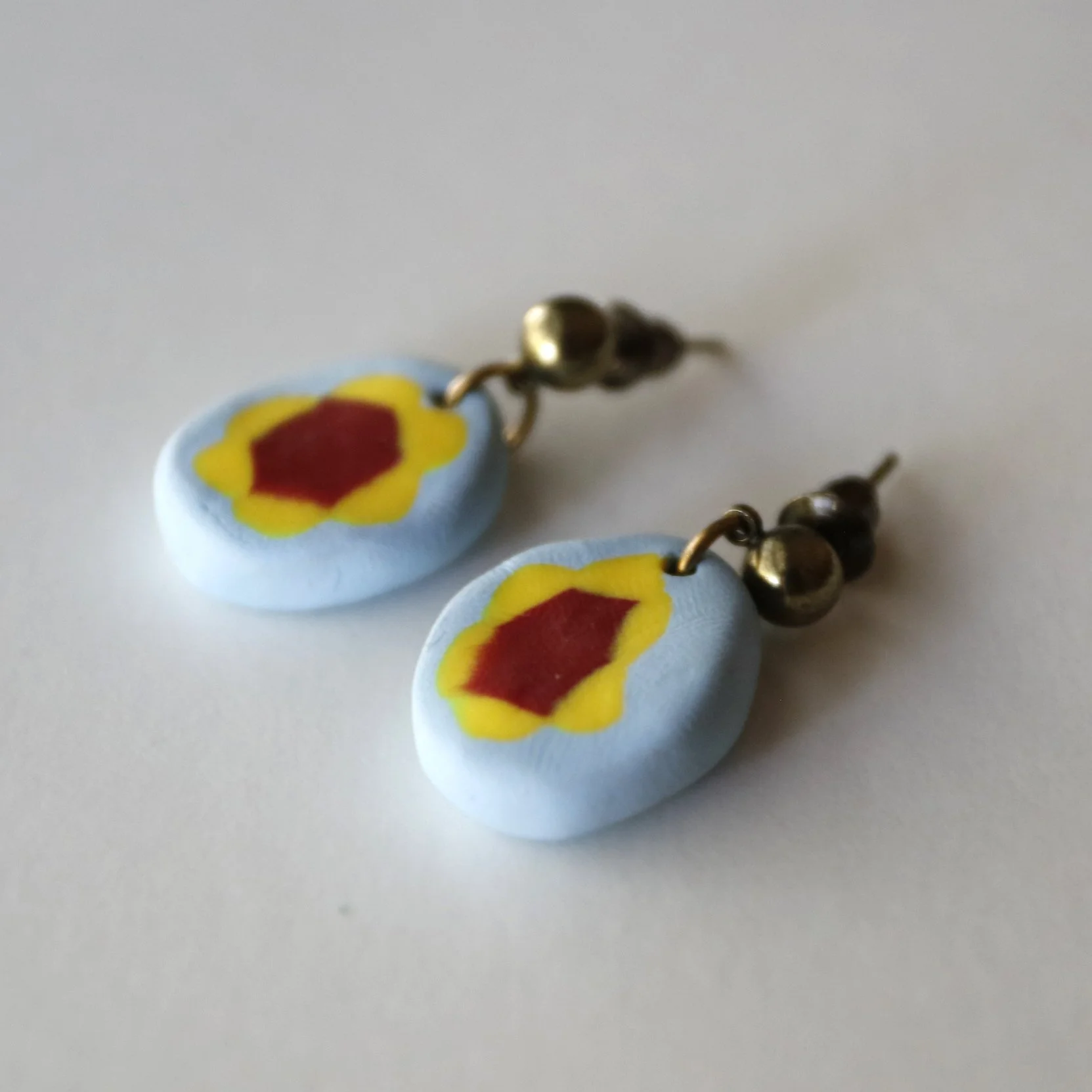 oval drop earrings with cute flowers