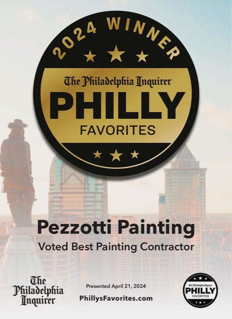 A certificate or award badge for Philly Favorites, recognizing Pezzotti Painting as the 2024 winner, with The Philadelphia Inquirer logo, a cityscape background, and text indicating Pezzotti Painting was voted best painting contractor, awarded on Apr