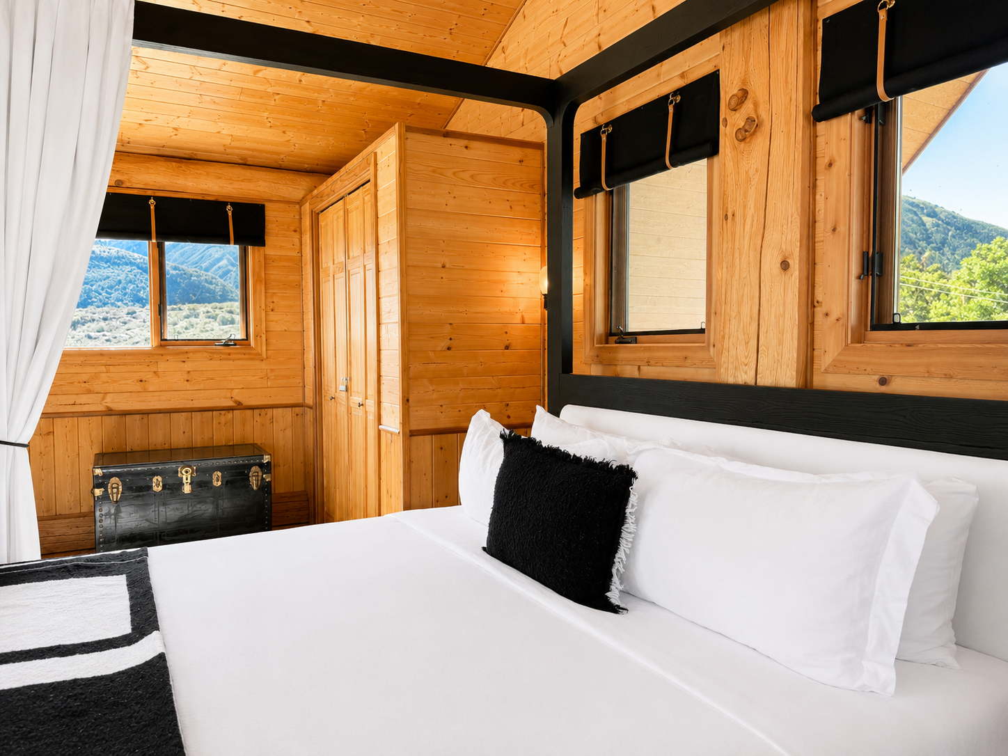 Bed positioned for canyon views through the loft windows
