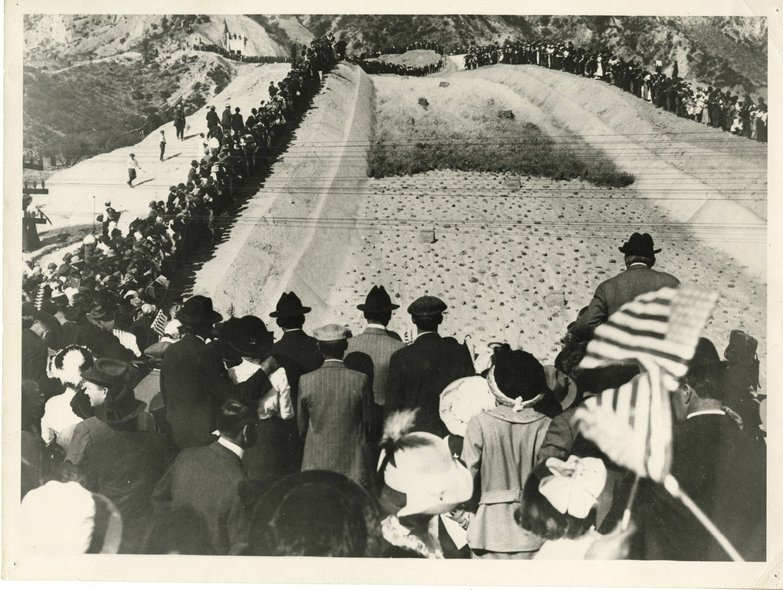  Crowd gathered around the Newhall Spillway, as the Aqueduct first fills up with water 1913 Nov 