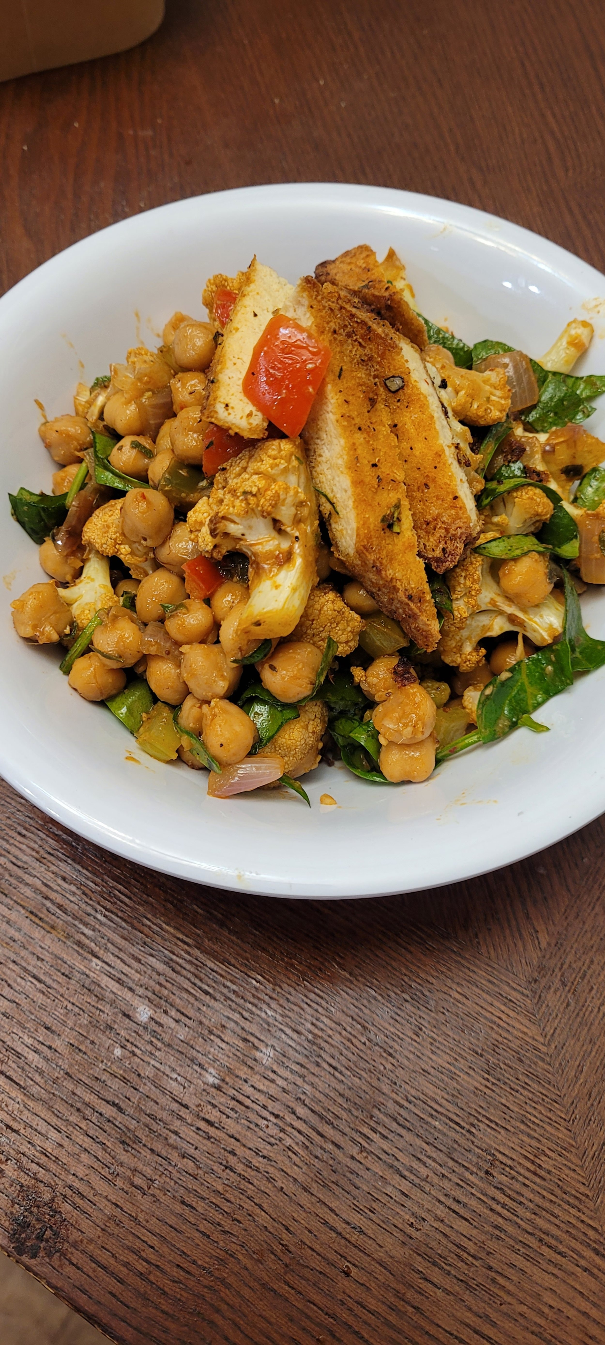 Red Curry Tofu w' Chick Peas, roasted cauliflower, peppers, onions, in  a light  herb red curry sauce (GF and Vegan)