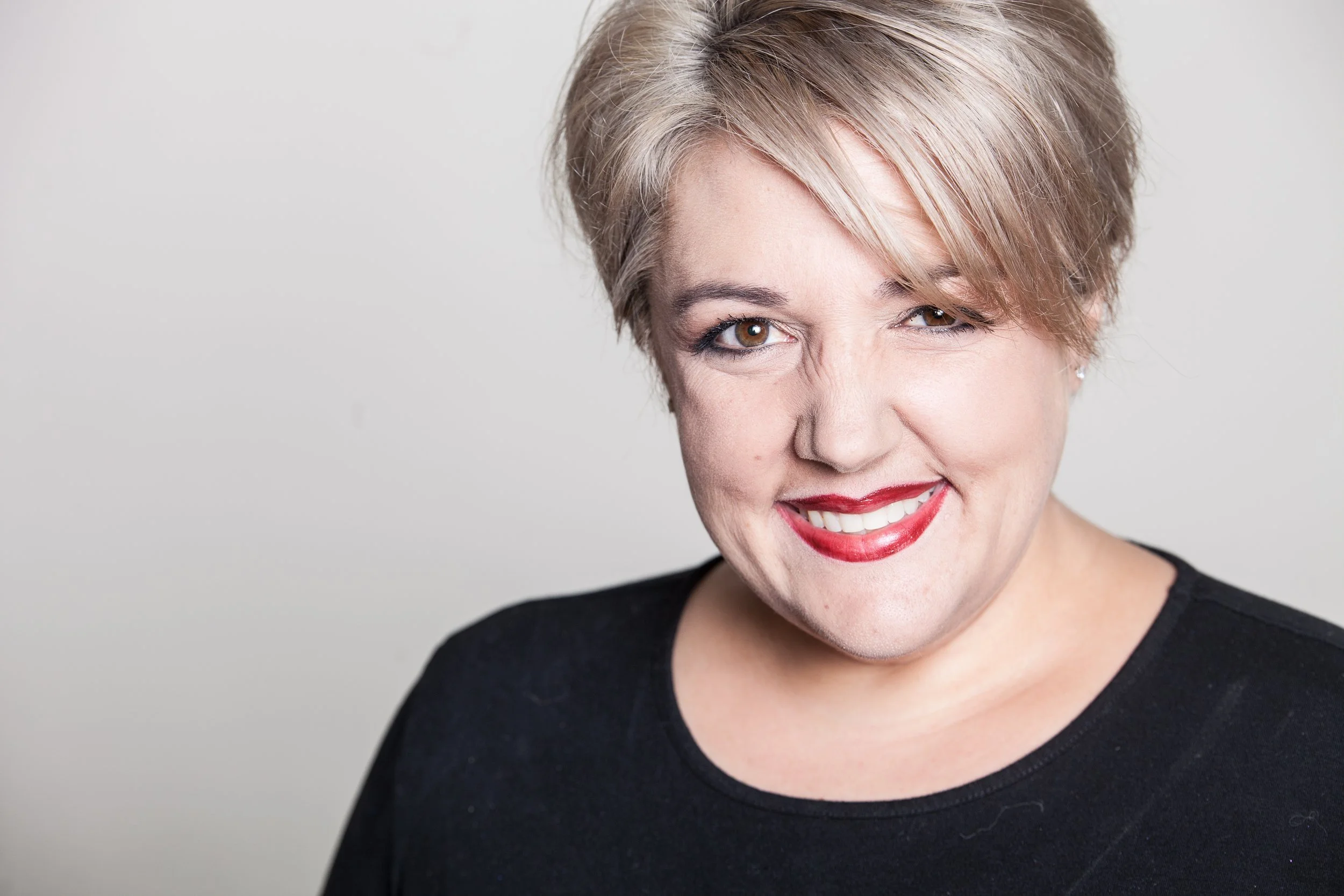 Lesli S at Salon Ardence, a board-certified hair colorist in East Baton Rouge, is smiling and ready to help clients achieve their ideal hair color.