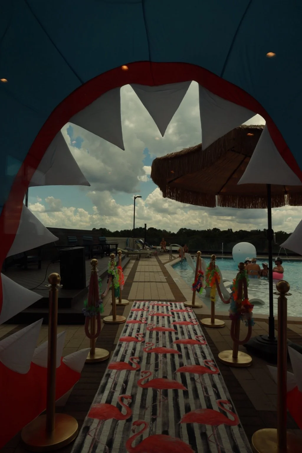 View from inside the inflatable shark entrance toward the rooftop pool at The Maddux at Shadowood