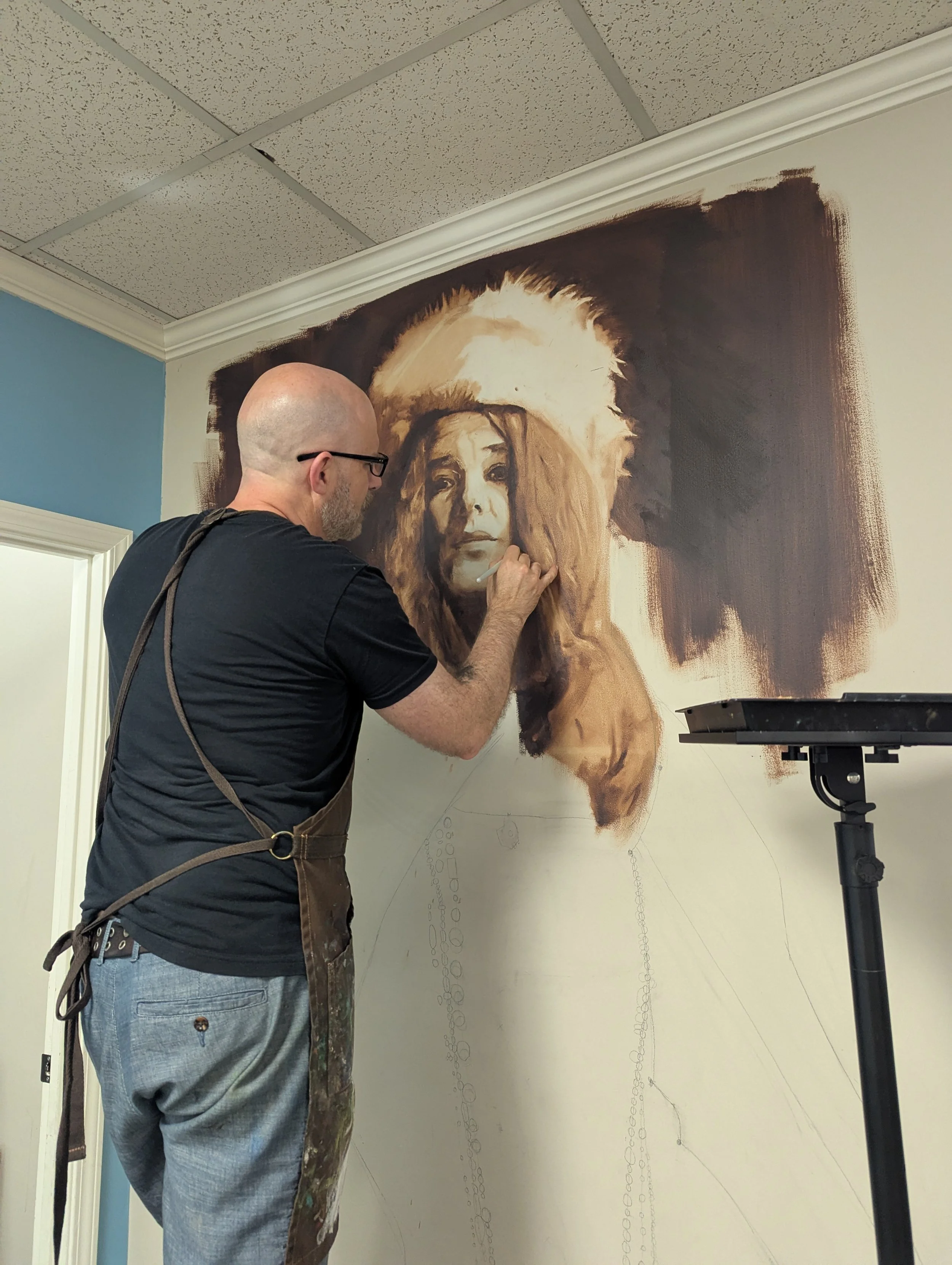 Dylan working on large oil painting portrait of Janis Joplin