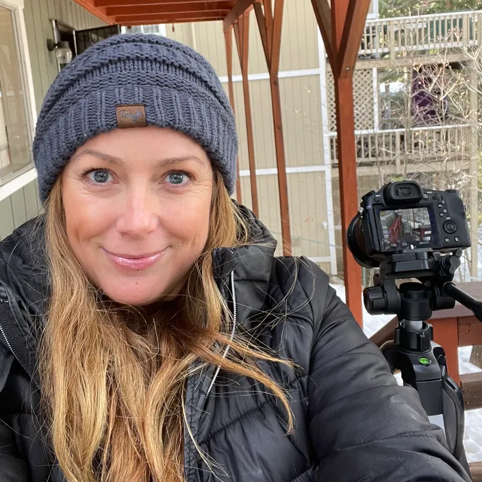 Andrea A. Jackson photo with camera and beanie