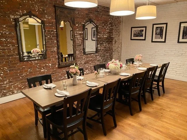  VIP Room  This space features a brick accent wall that adds a rustic touch and provides a beautiful backdrop for photos. Opposite the brick wall is a wall of windows that lets in plenty of natural light. The room can accommodate up to 20 seated gues