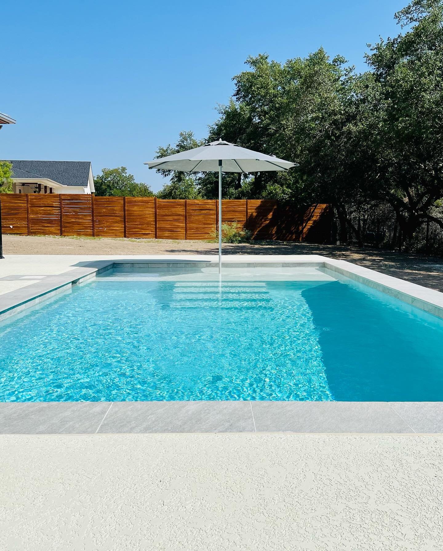 Check out our latest cocktail pool that is all about coordinating with the impeccably designed prairie style home it was built for. 

The homeowner went with stone-look tile and coping that blended seamlessly with the stone on the house. It turned ou