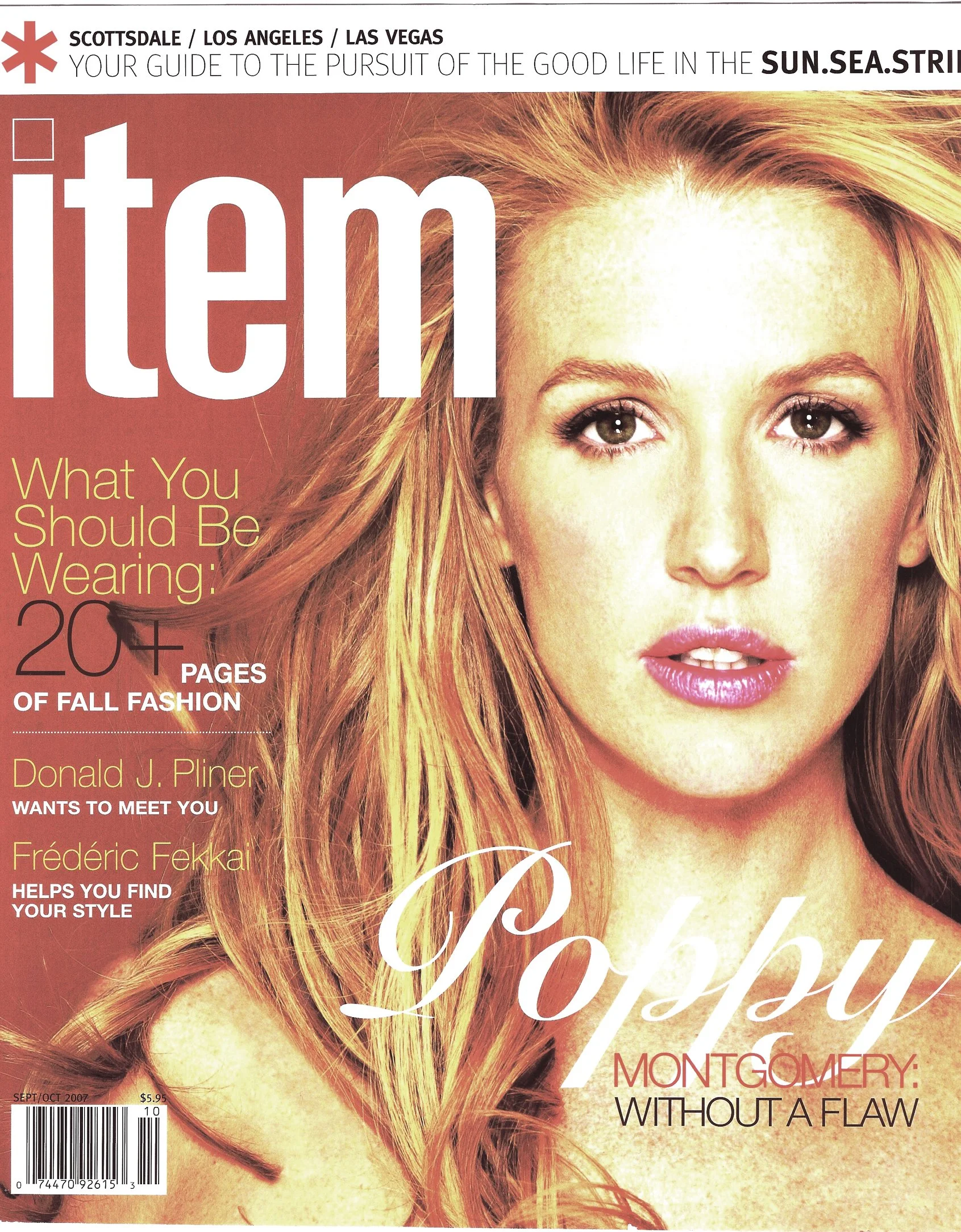 Close-up of a magazine cover featuring a woman with long, wavy red hair and makeup. The magazine title is partially visible with a large white text overlay reading 'love' and headlines about fashion, style, and a feature on Montgomery without a flaw.