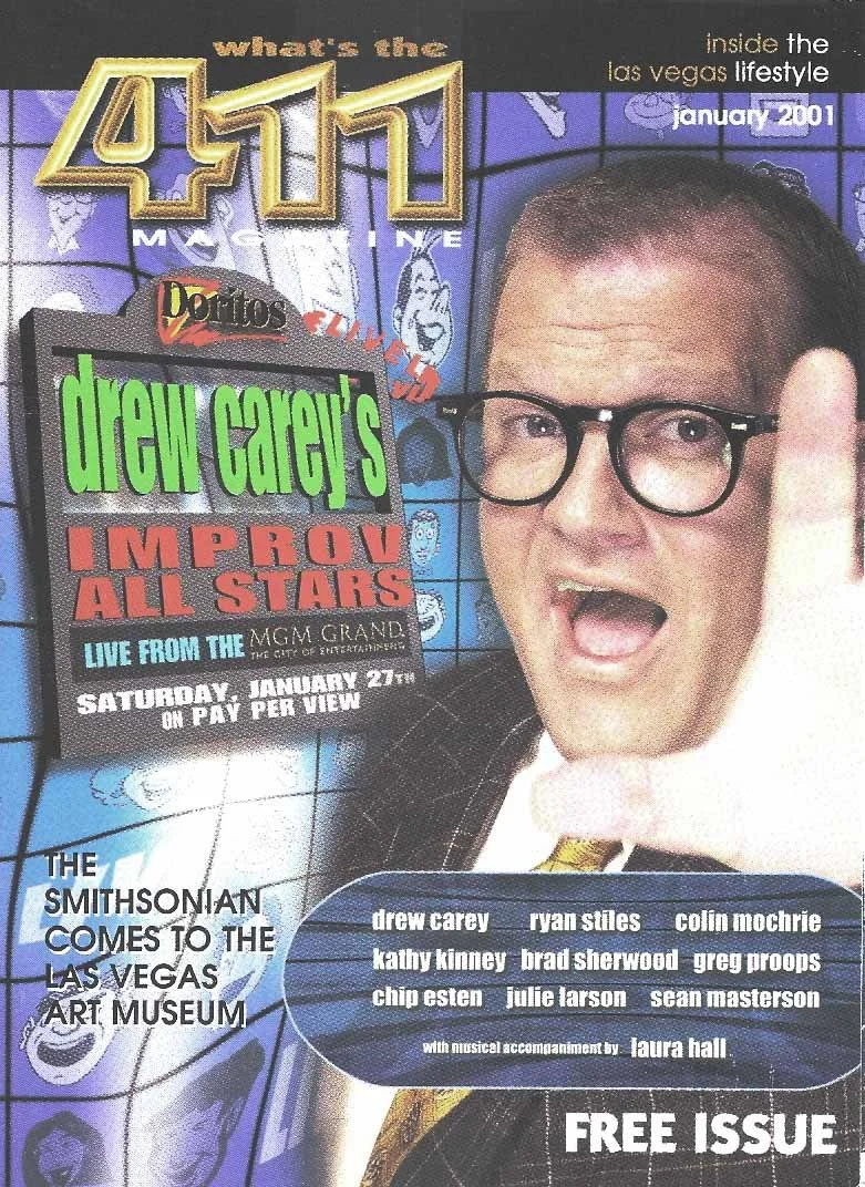 Magazine cover titled 'What's the 411 inside the Las Vegas lifestyle, January 2001'. Features a large photo of a man with glasses and an open mouth, giving a thumbs-up. Also showcases an advertisement for 'Drew Carey's Improv All Stars' live show at 