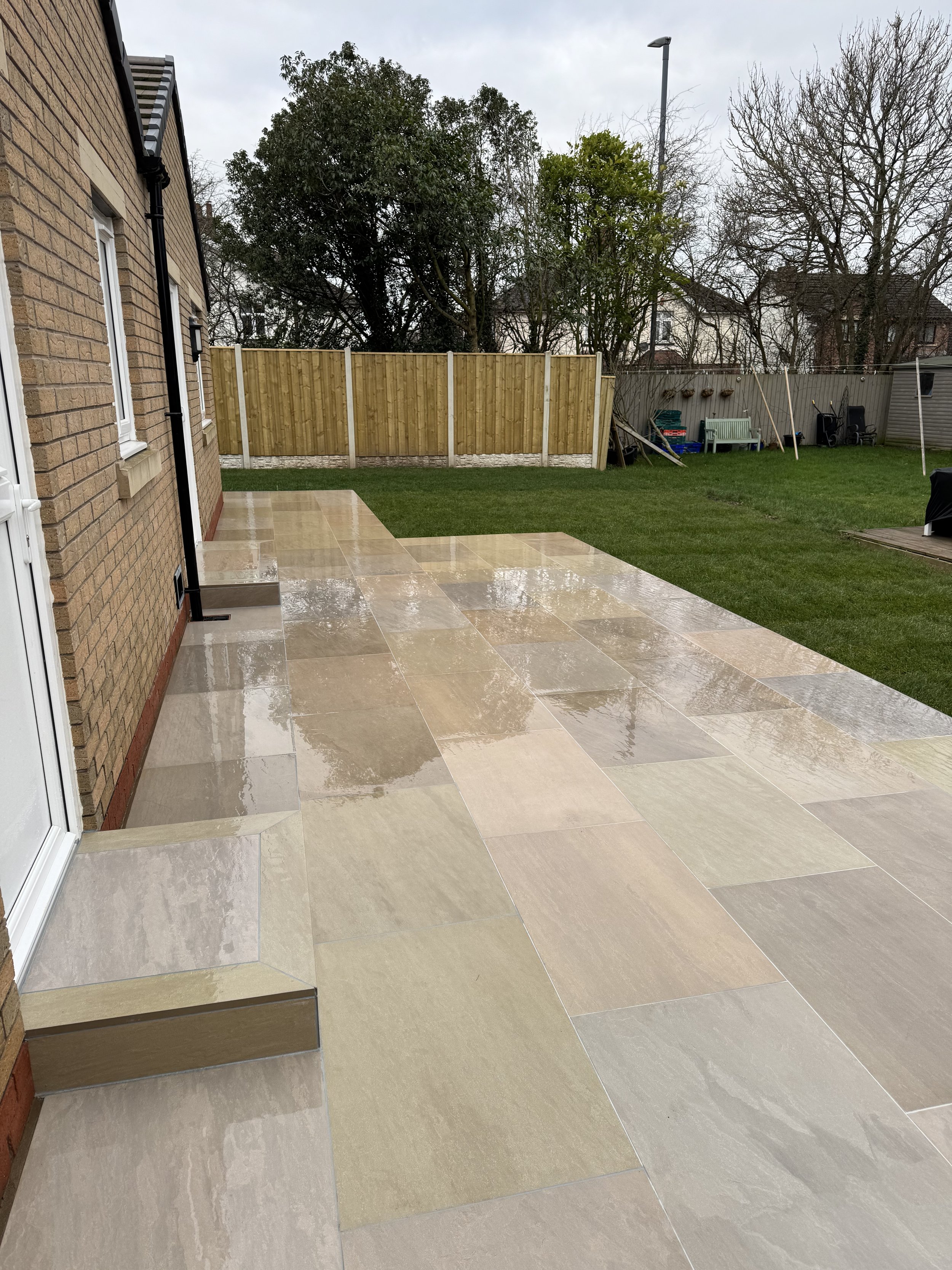 Raj blend porcelain patio and new lawn.