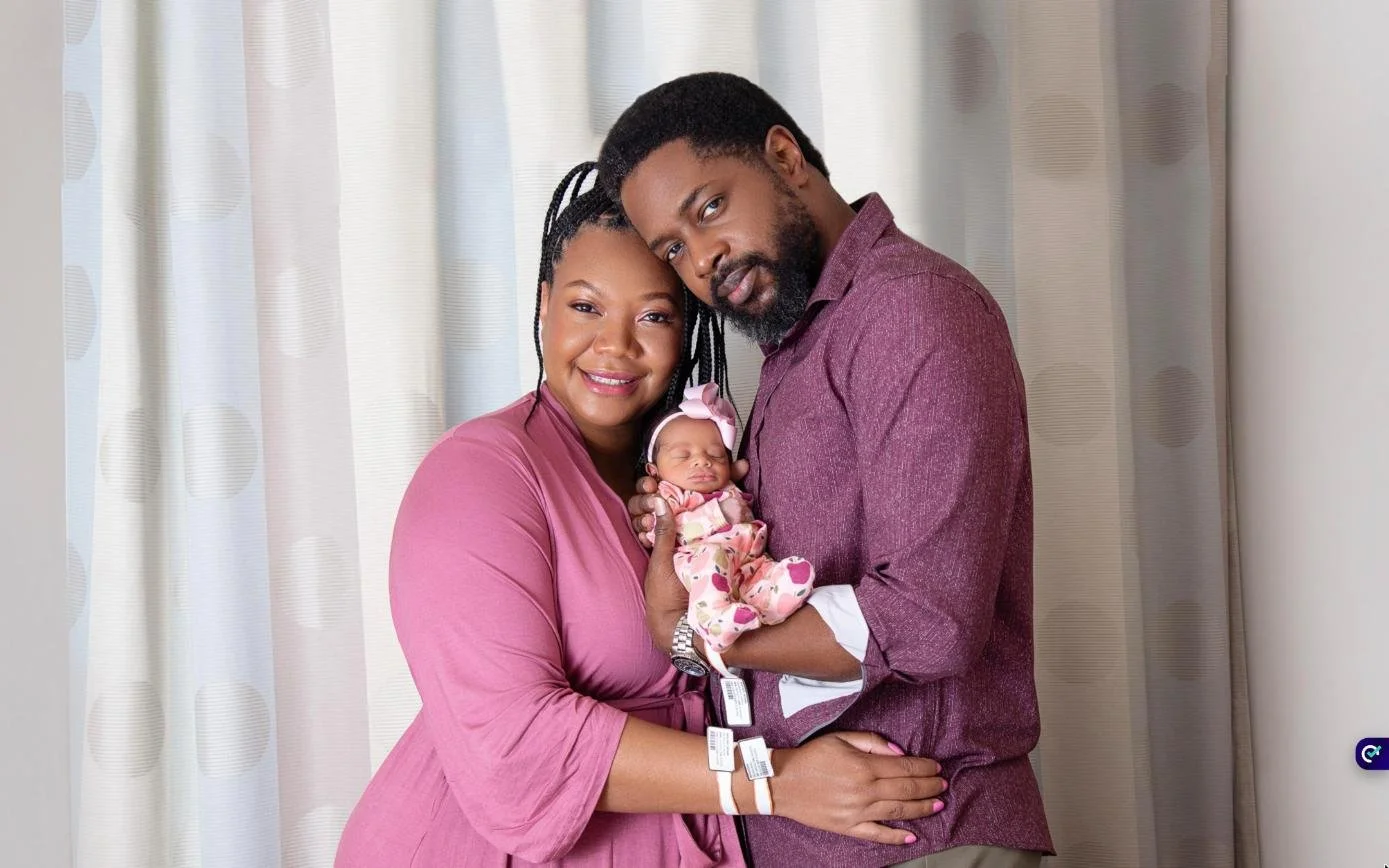Parents holding their newborn daughter during a Fresh48 hospital photo session at NYC Health + Hospitals/Bellevue, Manhattan