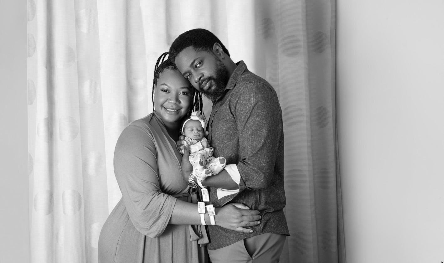 Parents cradling their newborn daughter during a Fresh48 hospital photo session at Saint Peter's University Hospital, New Brunswick NJ