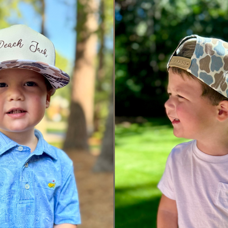 Child wearing Peach Jack youth camo hats