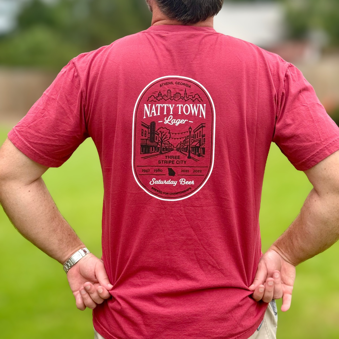 Man wearing Peach Jack Apparel Natty Town Lager Comfort Colors pocket tee inspired by college football Saturdays in Athens, Georgia. This image shows the back graphic.