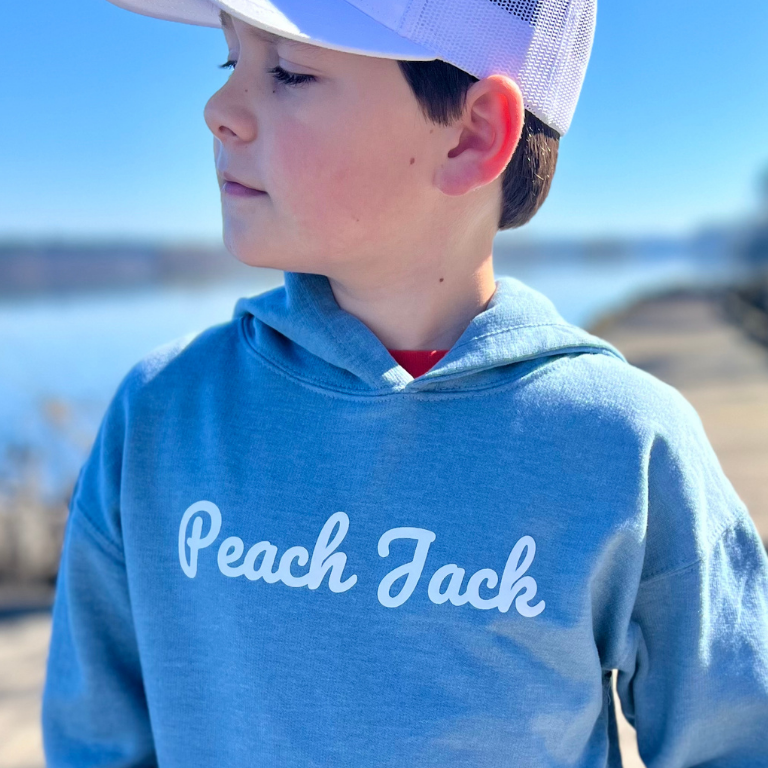 Picture of child wearing a Peach Jack hoodie