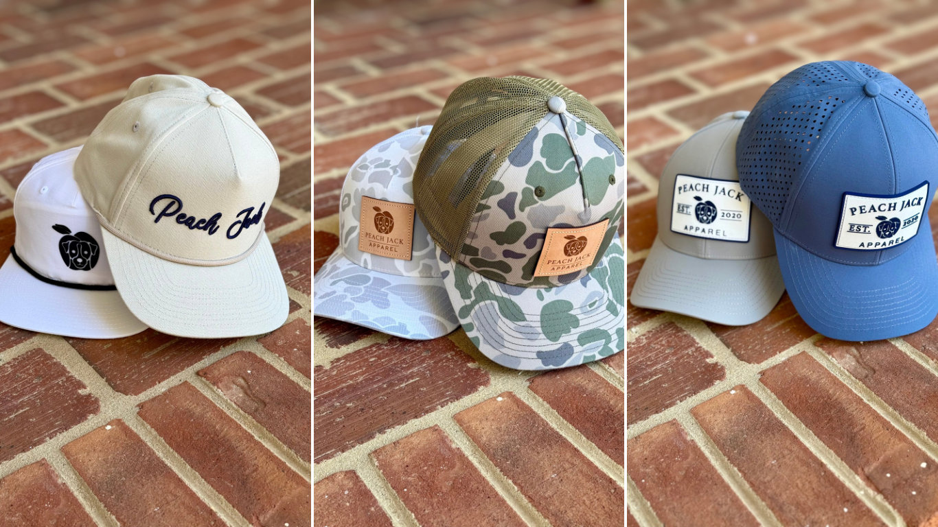 A picture of six peach jack apparel hats as an advertisement for our buy 2 hats get 1 free sale. Customers must add 3 hats to their cart to see the free hat discount applied at checkout.