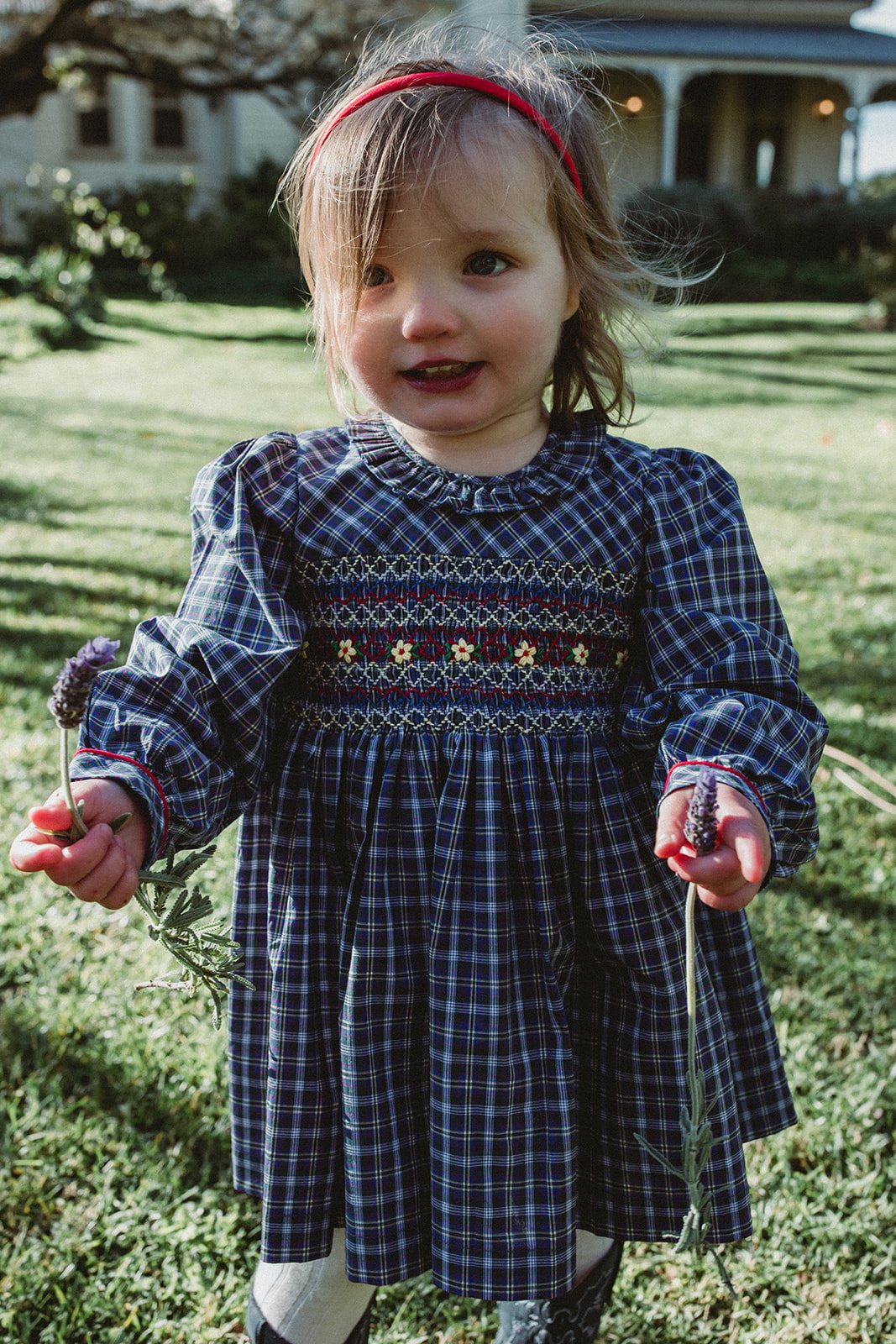 Sweet little baby girl wearing a winter smock dress.