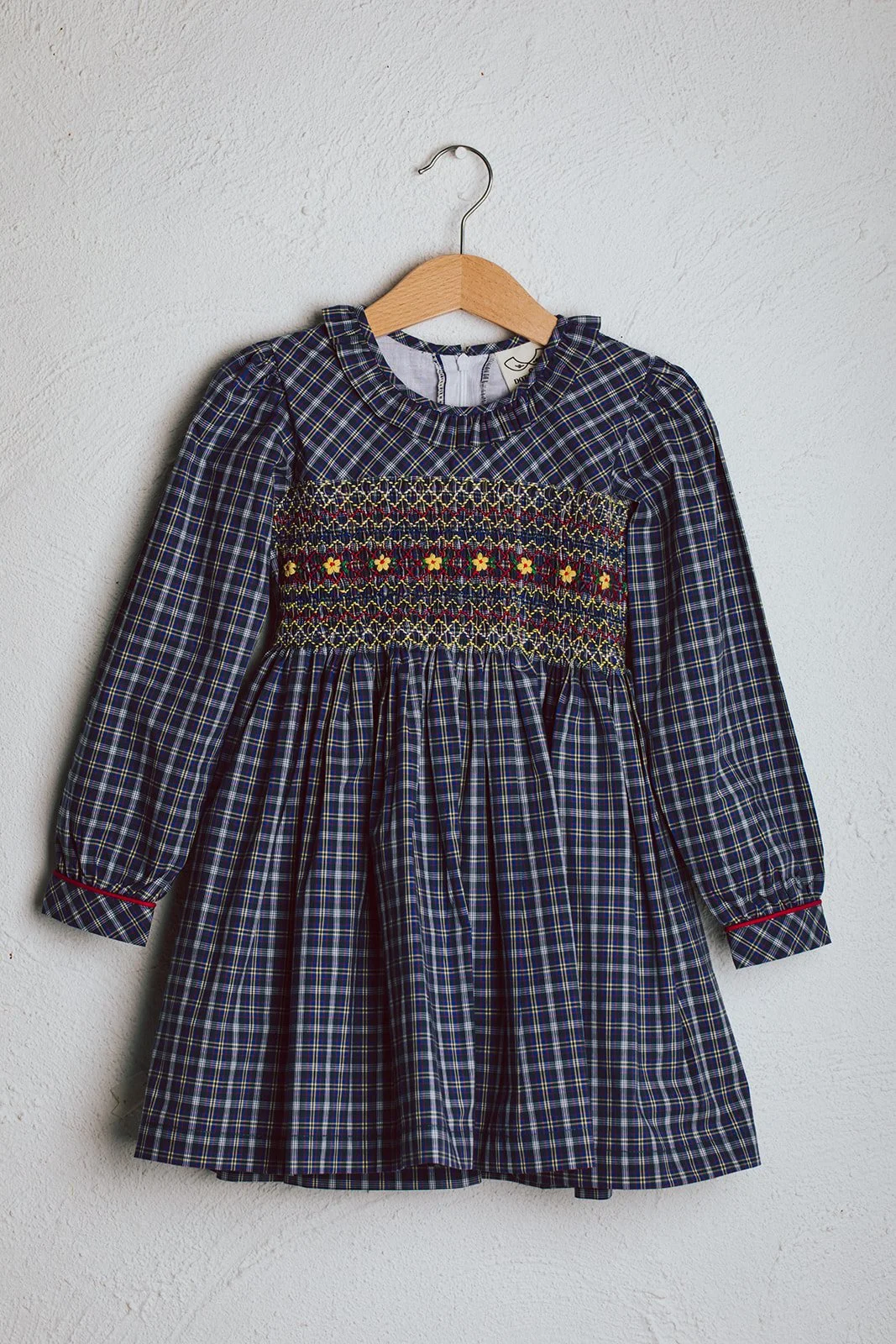 Front of the Willow check smocked winter dress from Australian luxury kids boutique Dot and Mila.