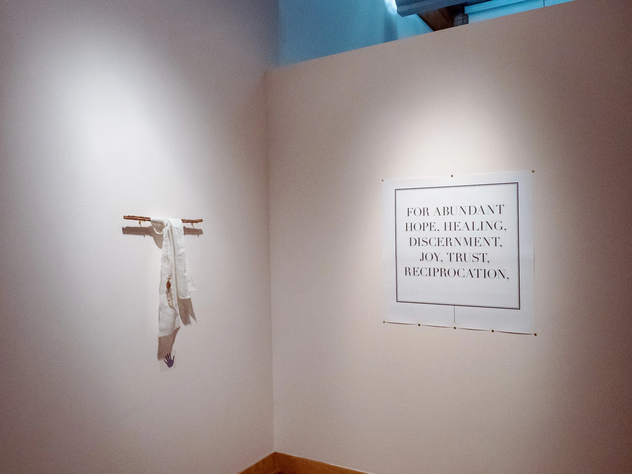 Installation Shot (From Left)  "refracted light thru a love that moves you"
ink on silk, hand engraved copper, beads of red agate, silver, 24k gold, glass, blue moonstone, rose quartz, and pyrite, suspended on authentic jaffna cinnamon 
/ Poster