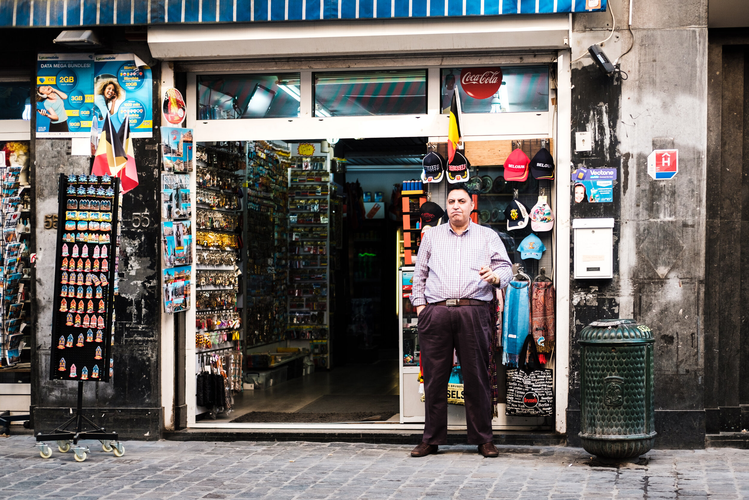 Shopkeeper having a smoke, Brussels