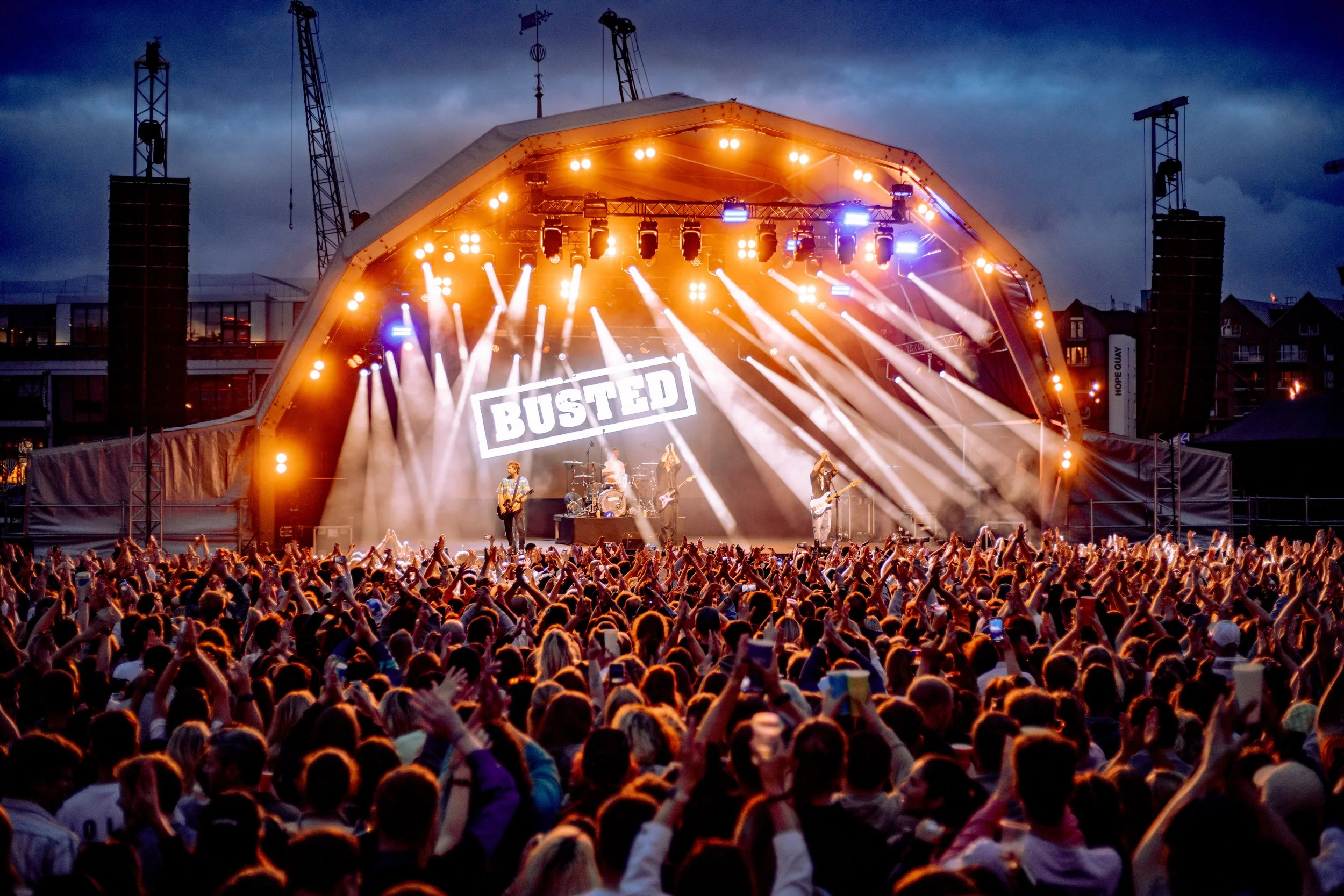 Crowd reacting during a live gig at a Bristol Sounds music venue
