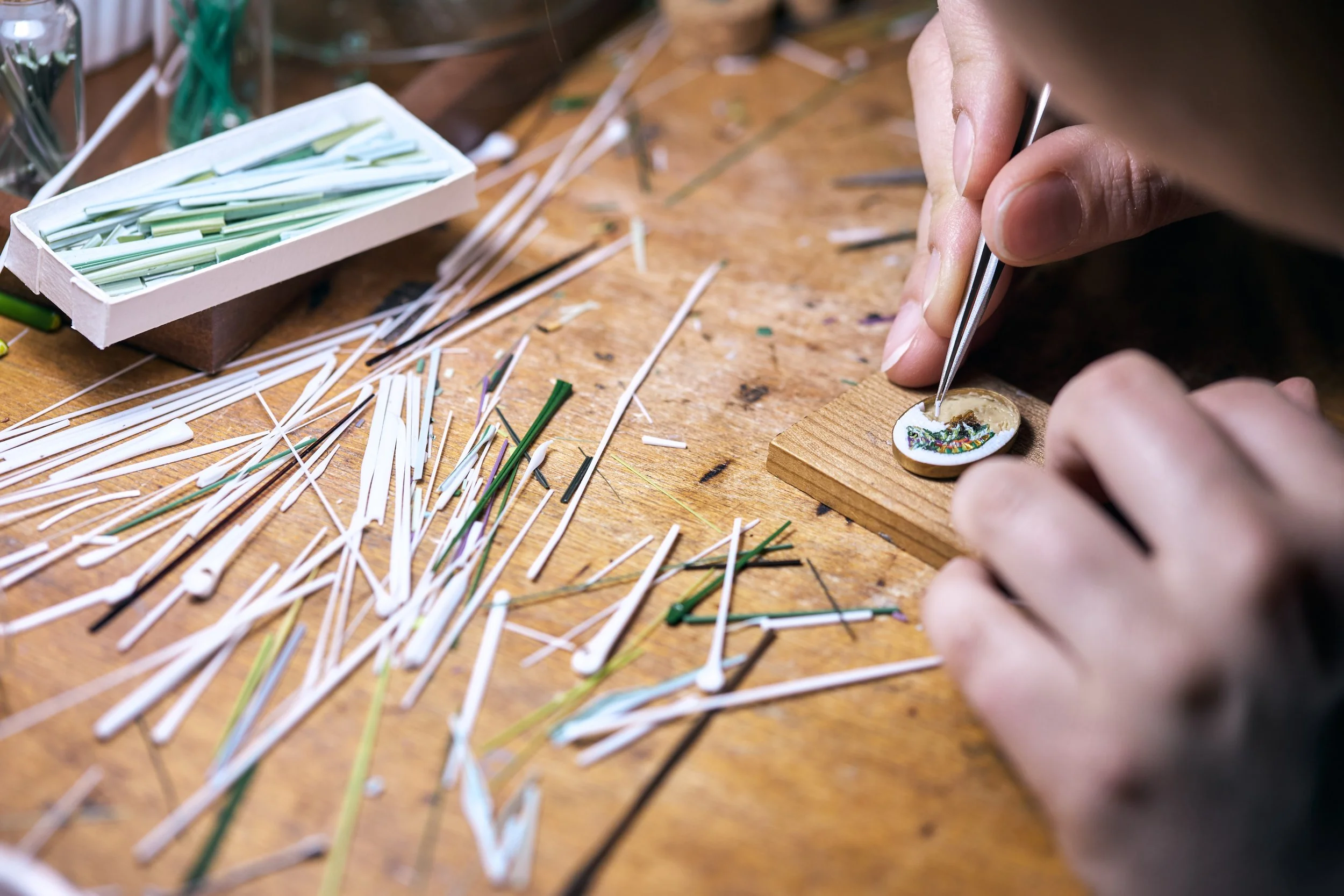 Rebecca Di Filippo placing a tessera in a micromosaic