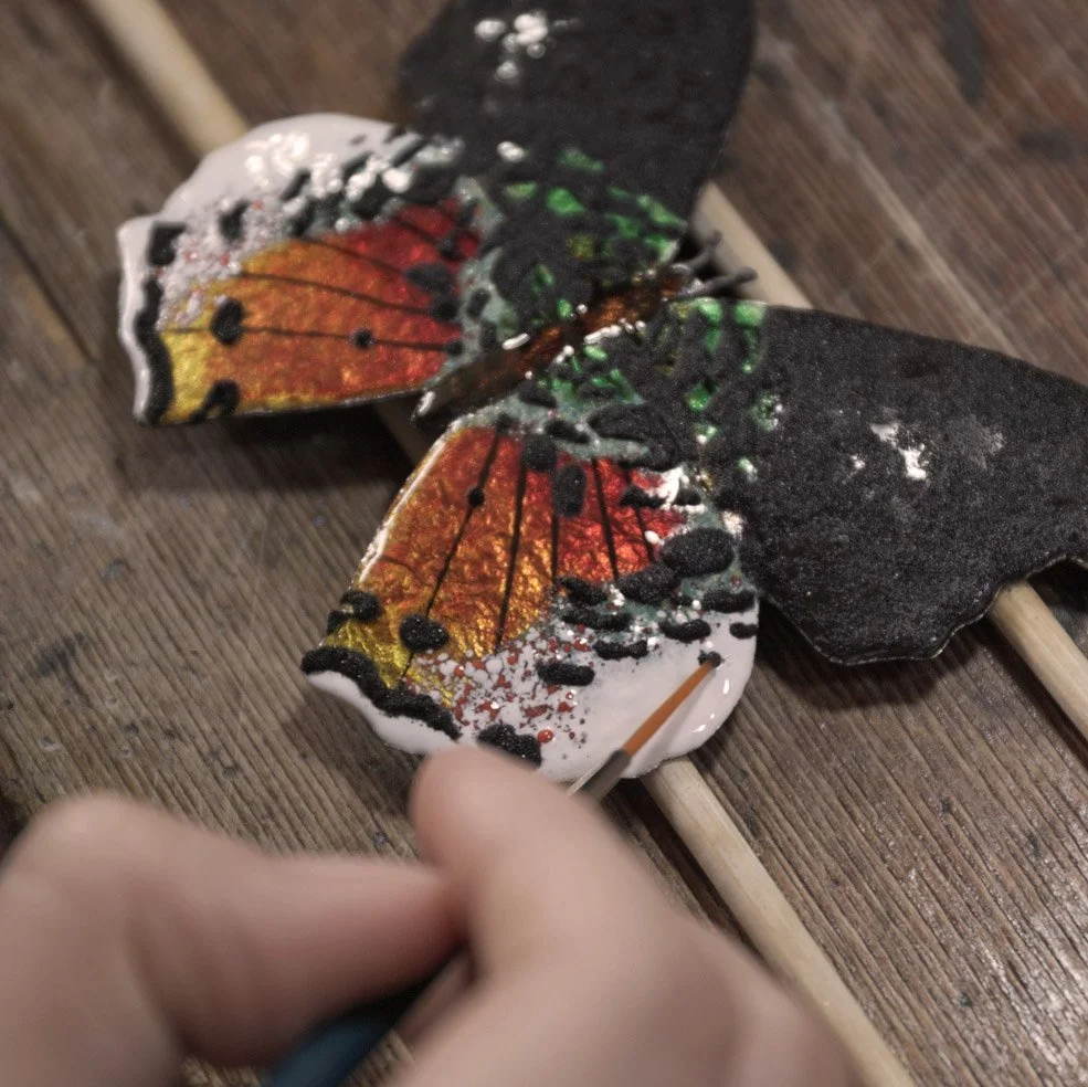 Wet packing opaque black enamel.