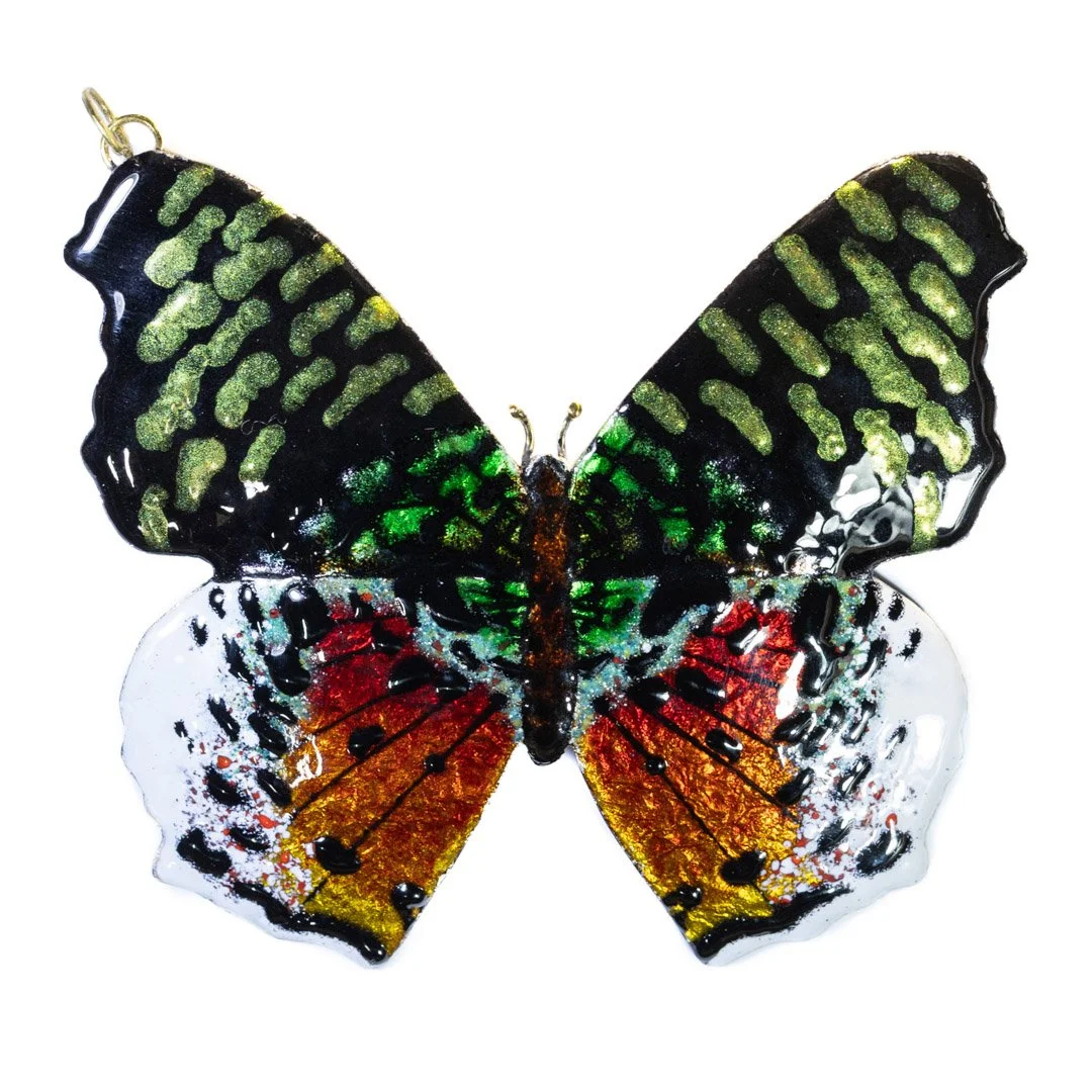 Finished piece made with transparent, opaque and metallic effect enamels over silver foil on copper base.