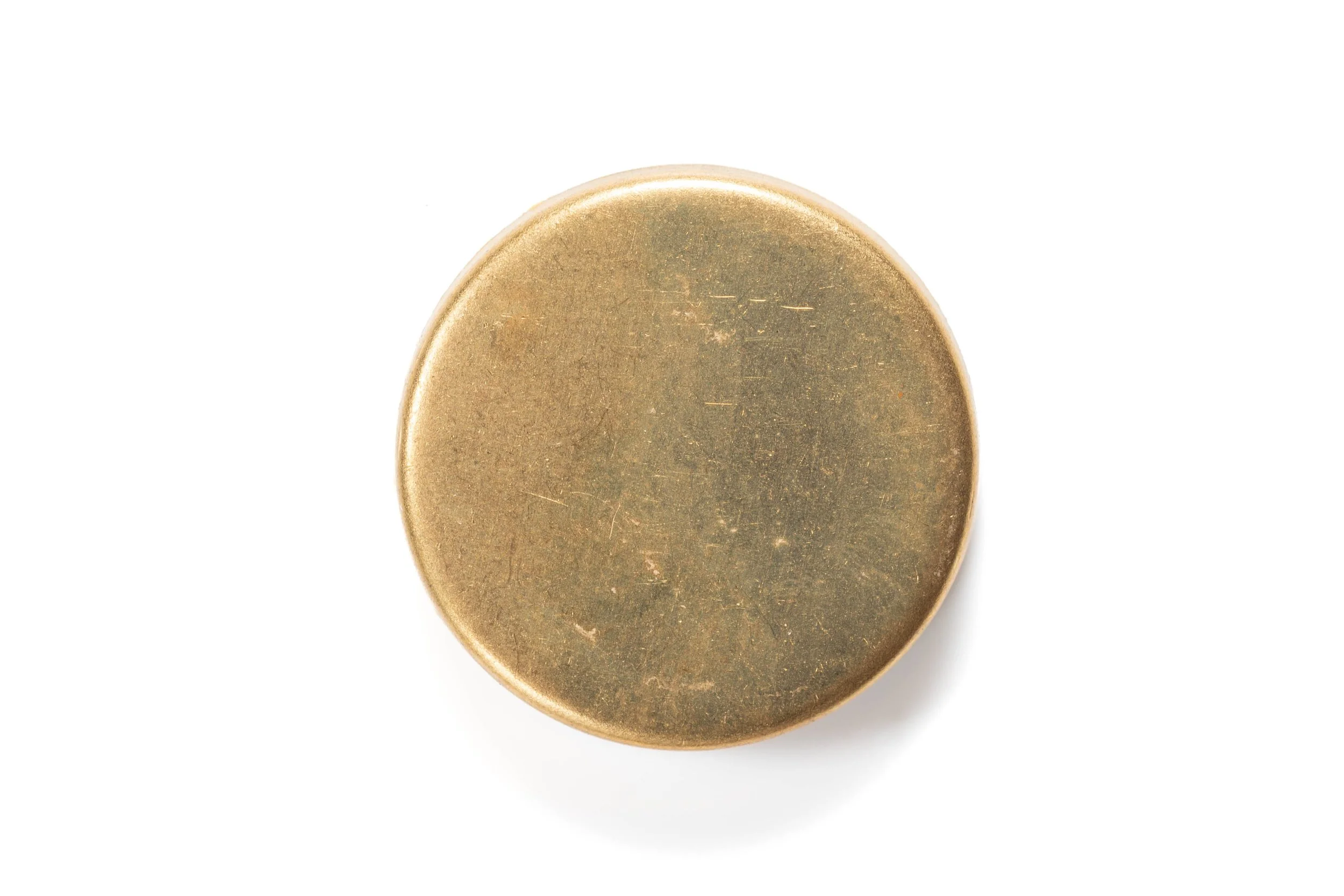Rear view of the pink macaron cabochon, showing its plain round gold-colored metal base.