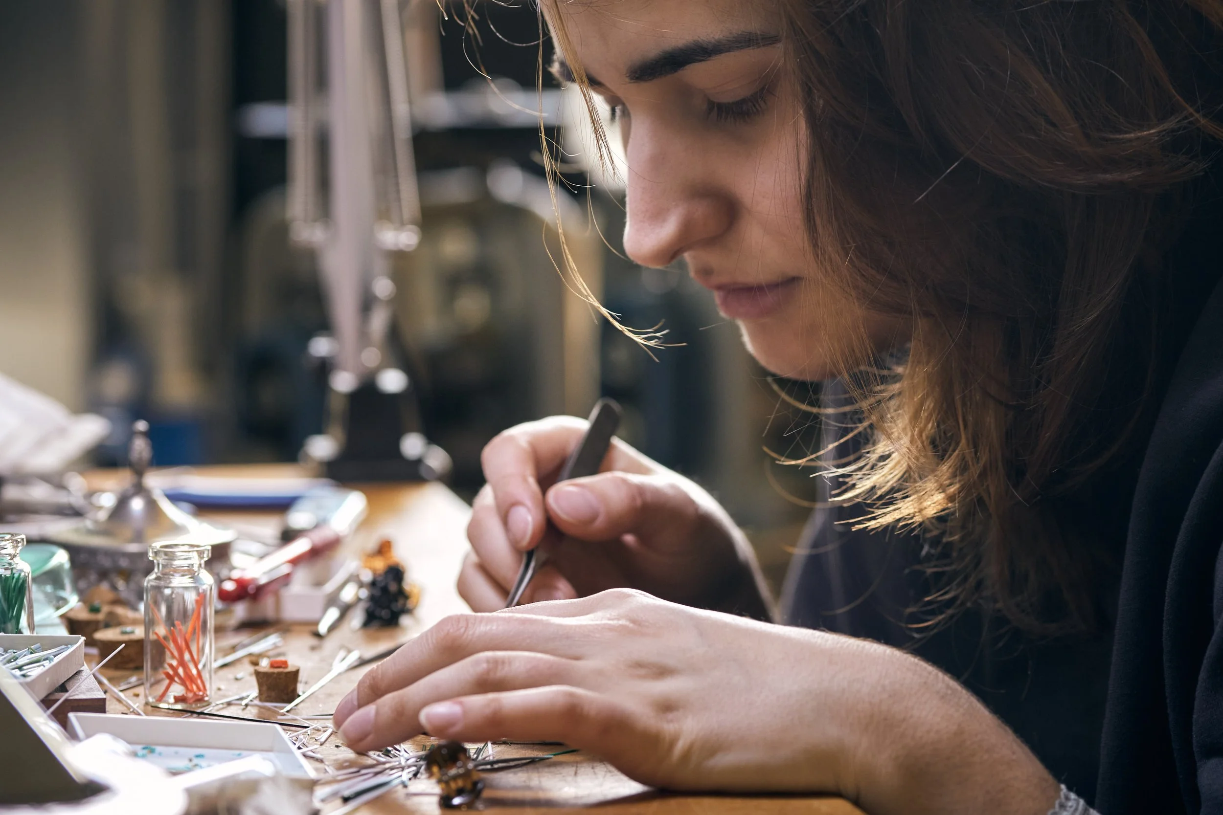 A portrait of Rebecca Di Filippo while she's creating a micromosaic