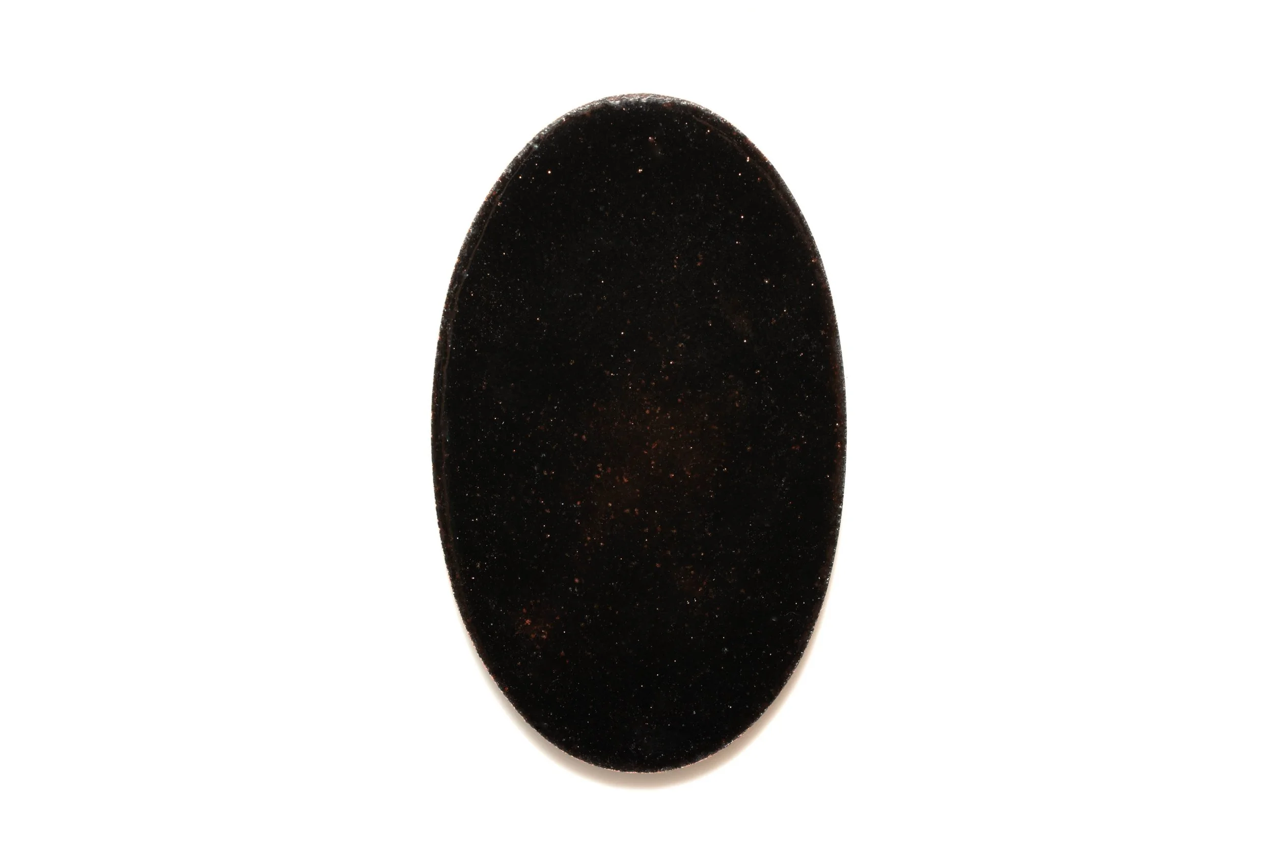 Rear view of the jellyfish enamel cabochon, showing its dark oval back.