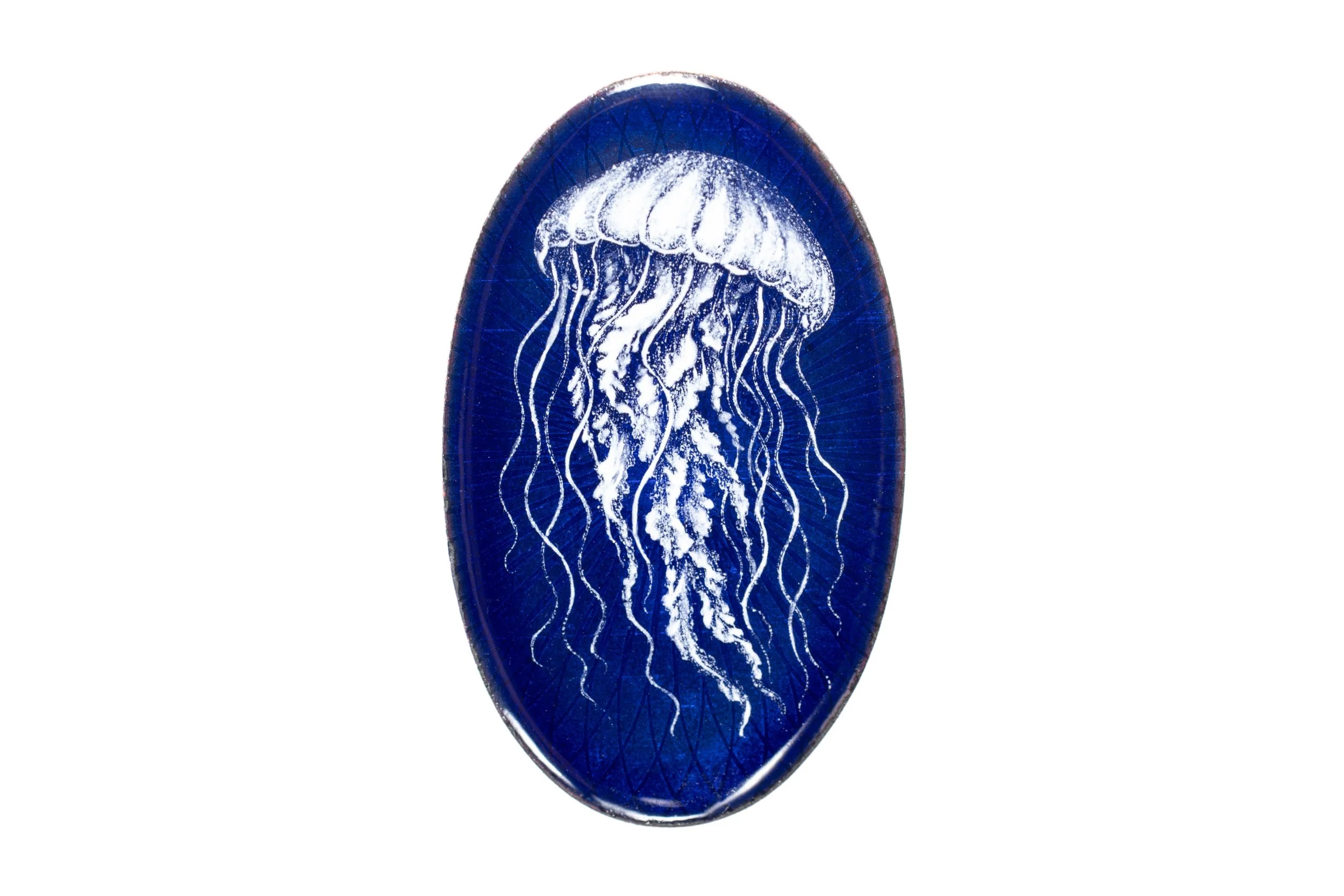 White jellyfish painted in grisaille enamel on a deep blue oval cabochon, front view.