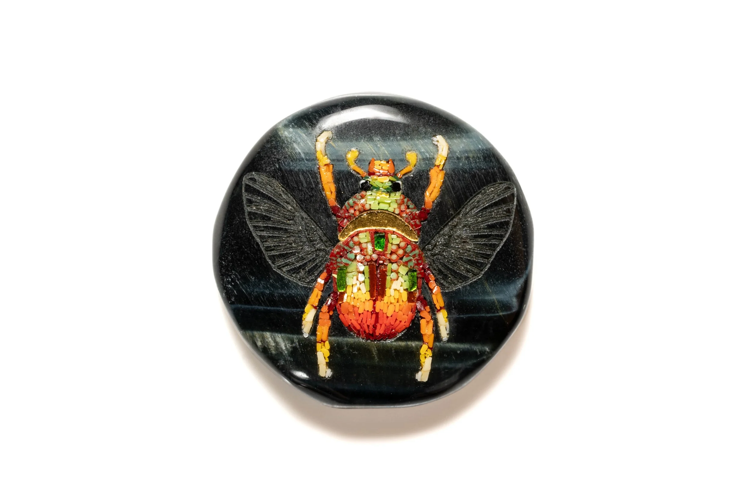 Red beetle with open wings in Murano glass micromosaic, set into a carved black stone cabochon.